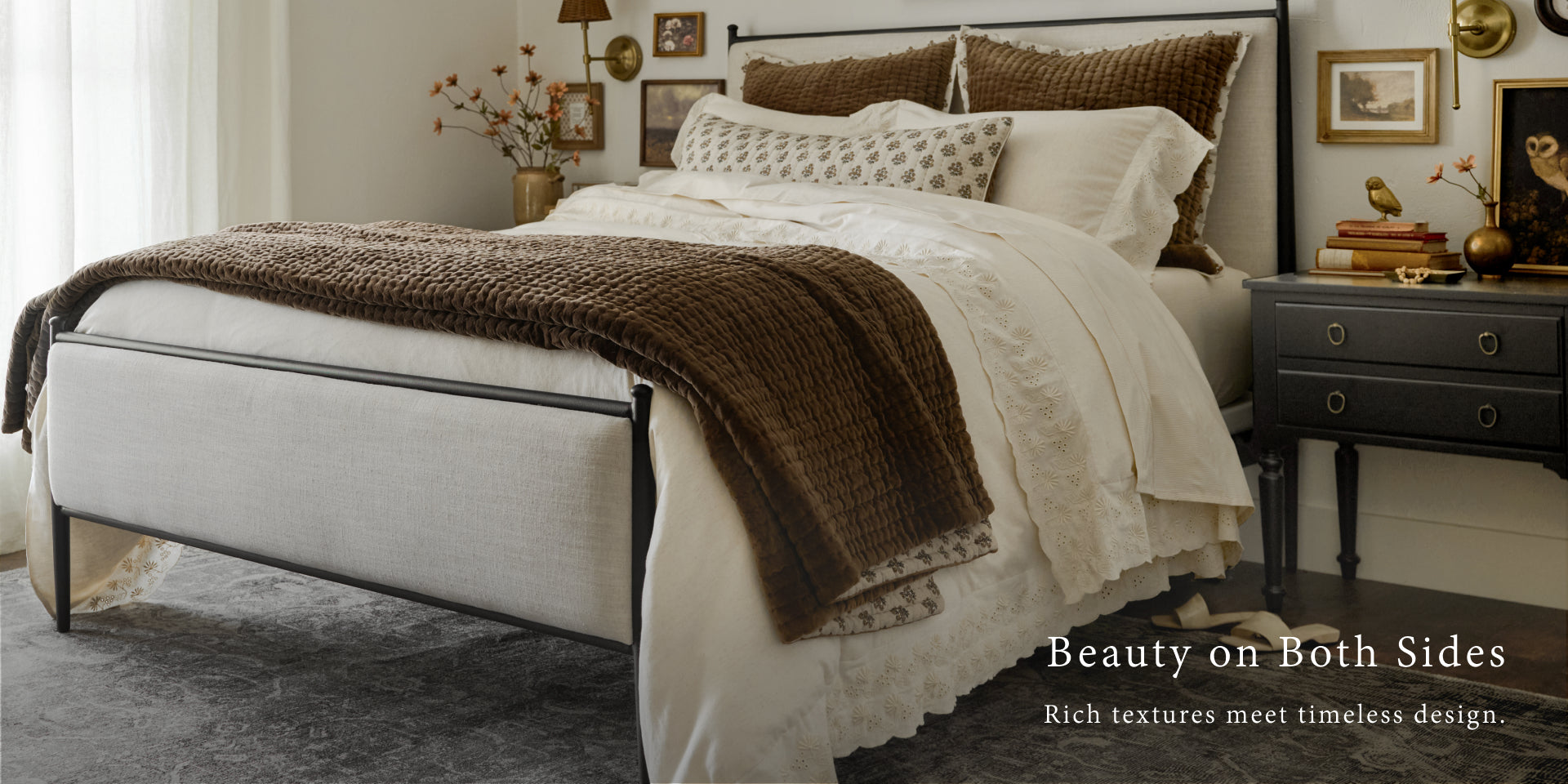 Neatly made bed with brown and white bedding in a bedroom setting.  Shop Bedding.