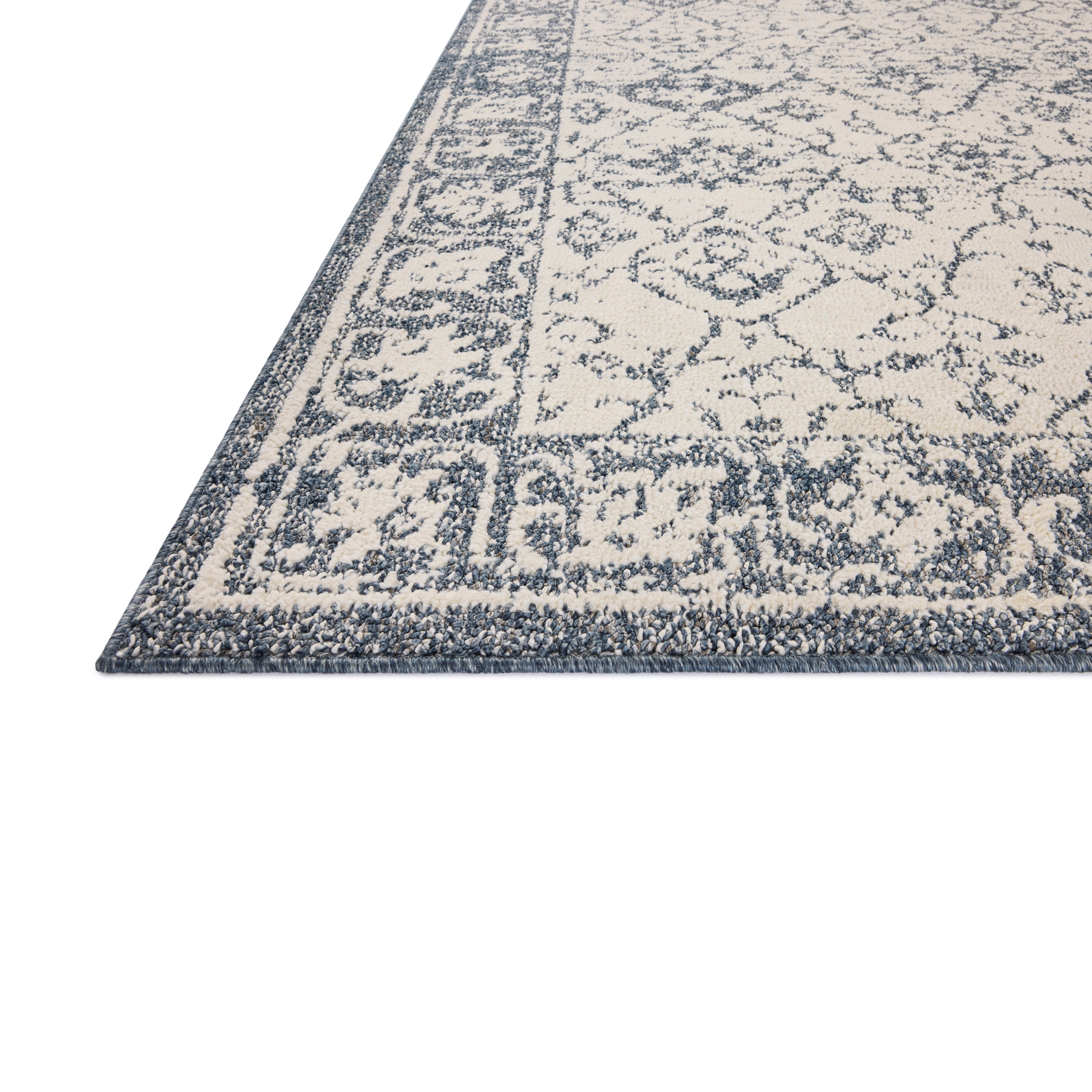 Gigi Ivory Blue Rug close up of corner