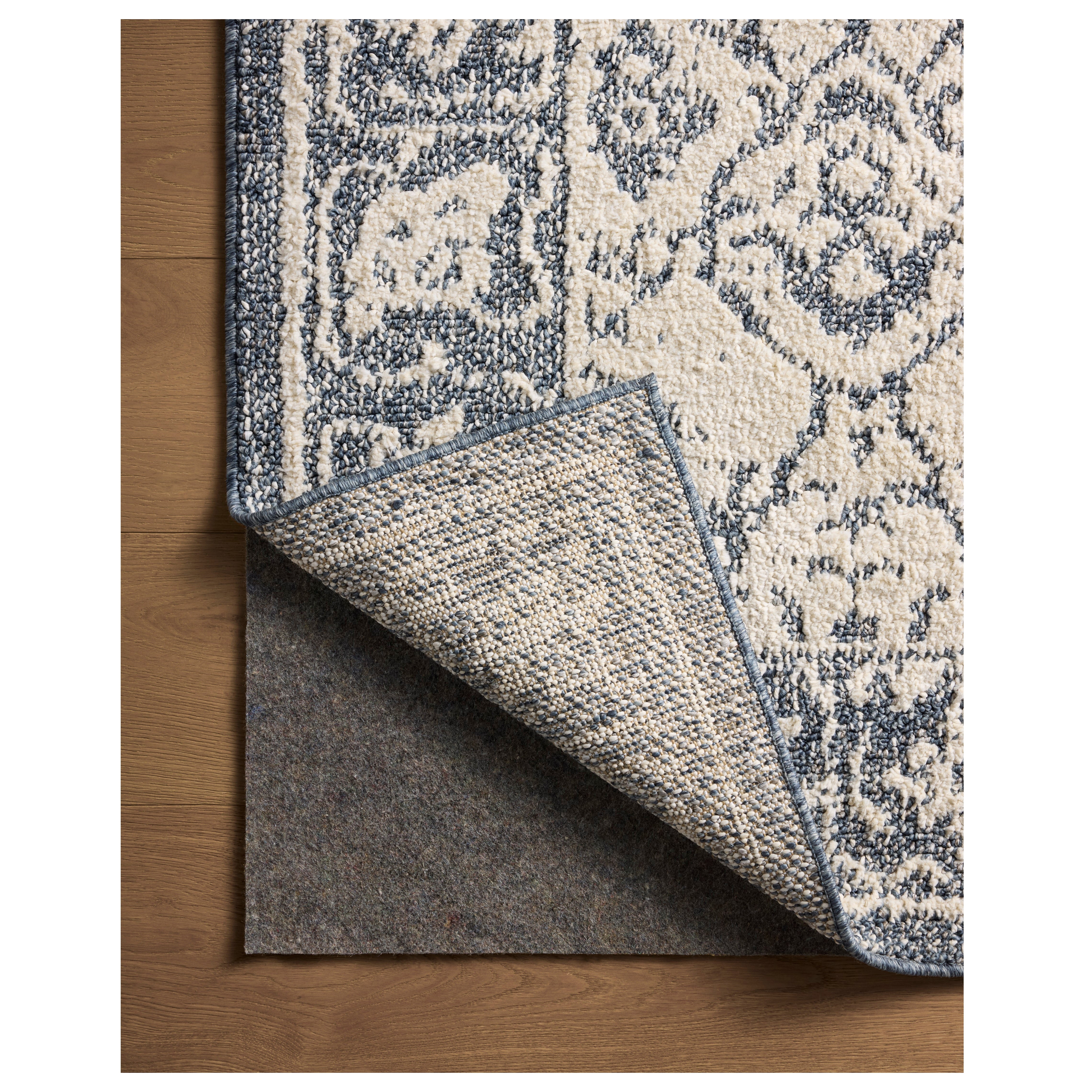 Gigi Ivory Blue Rug corner folded back
