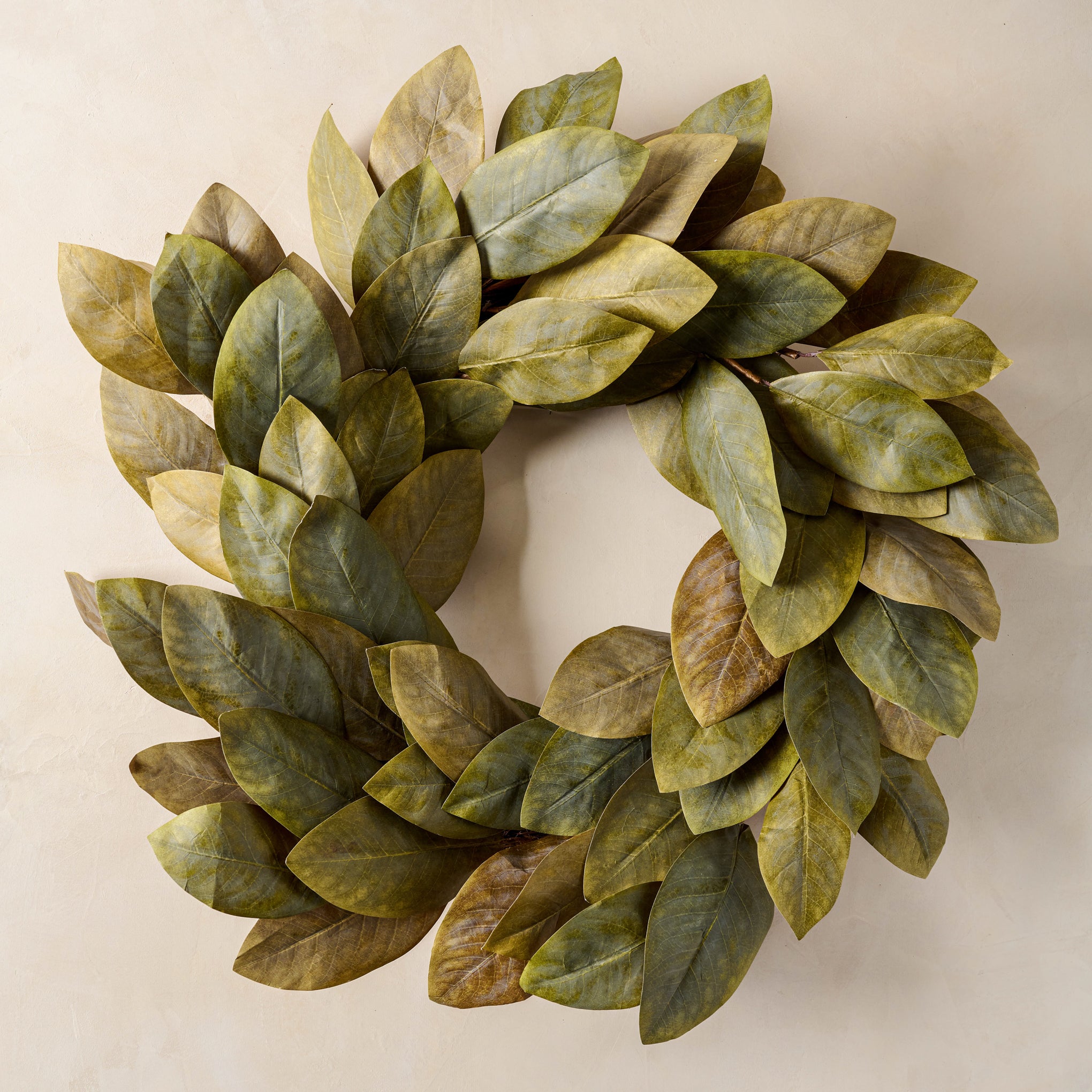 Signature Magnoliass Wreath with beige background