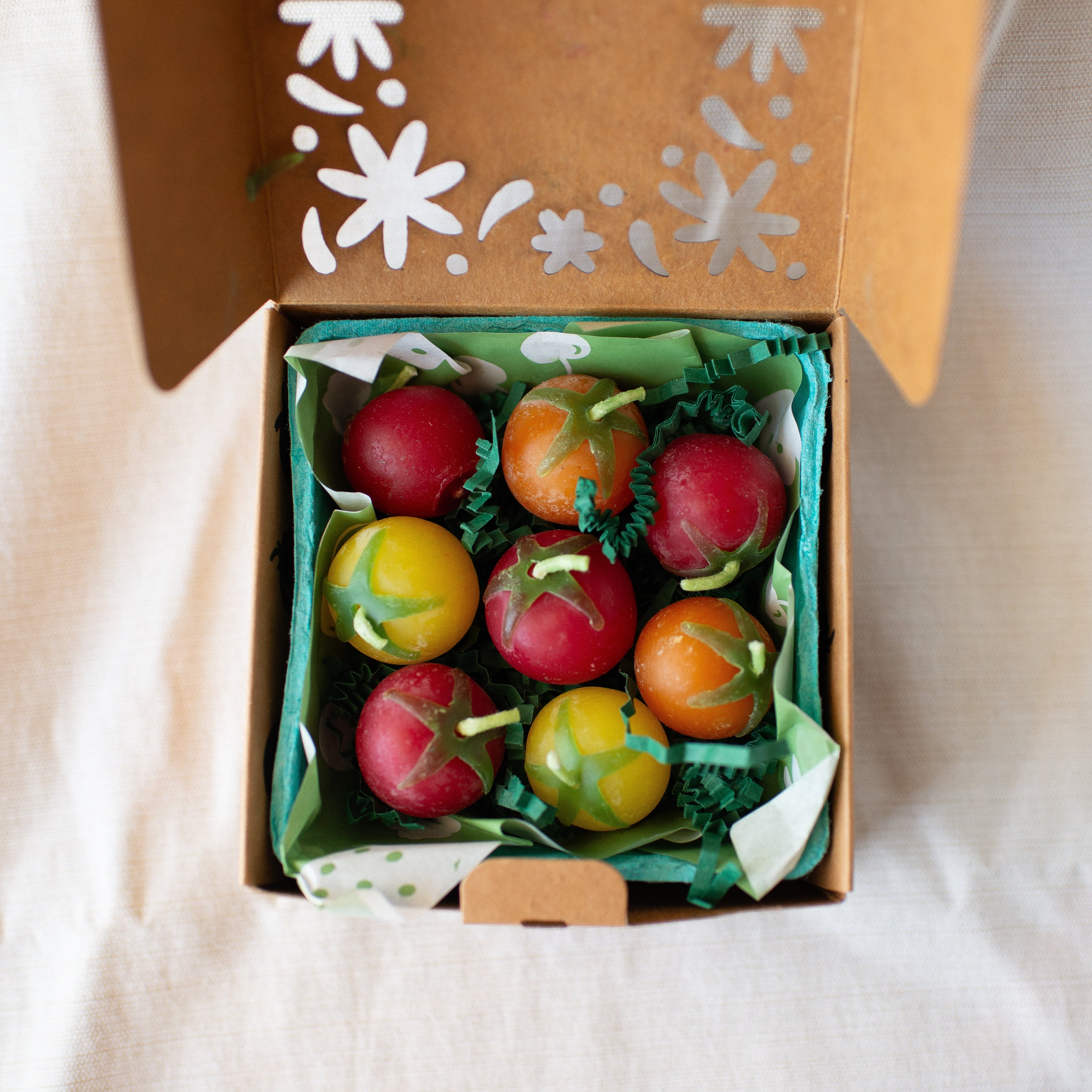 Cherry Tomato Birthday Candle Set of 8 shown from above in box
