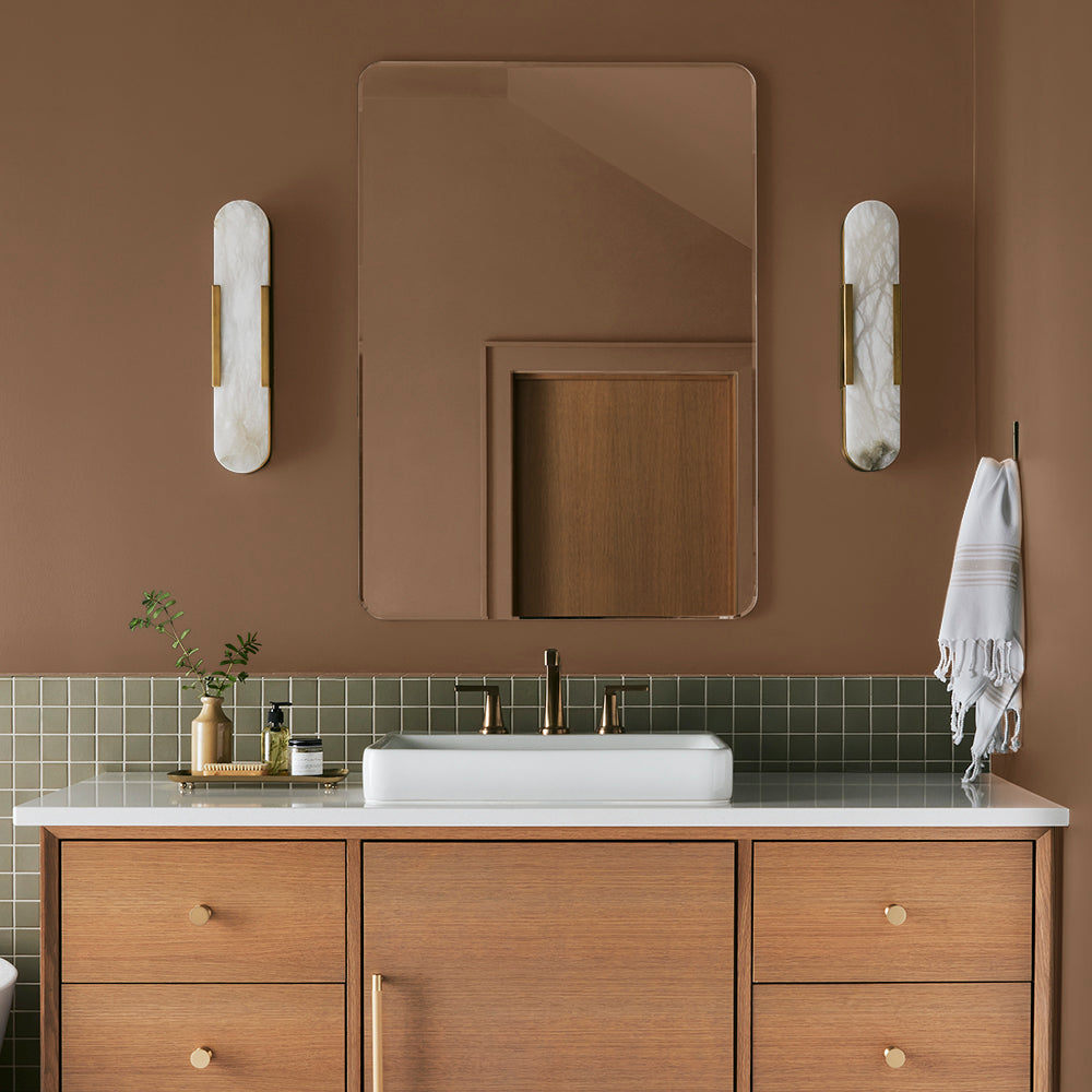 earthy brown with reddish hue paint color named cognac shown painted on bathroom wall
