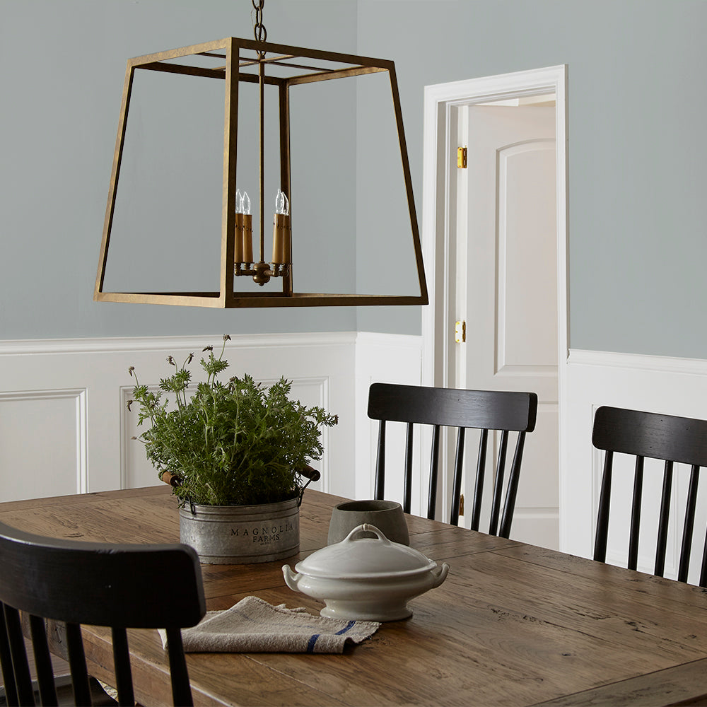 neutral grey with a tinge of blue paint color named tranquil waters shown painted on dining room wall