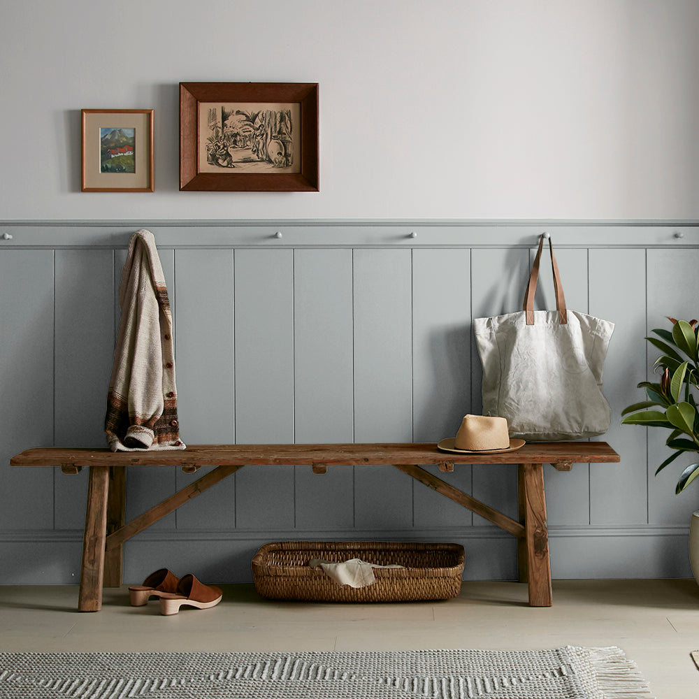 neutral grey with a tinge of blue paint color named tranquil waters shown painted on entryway wall