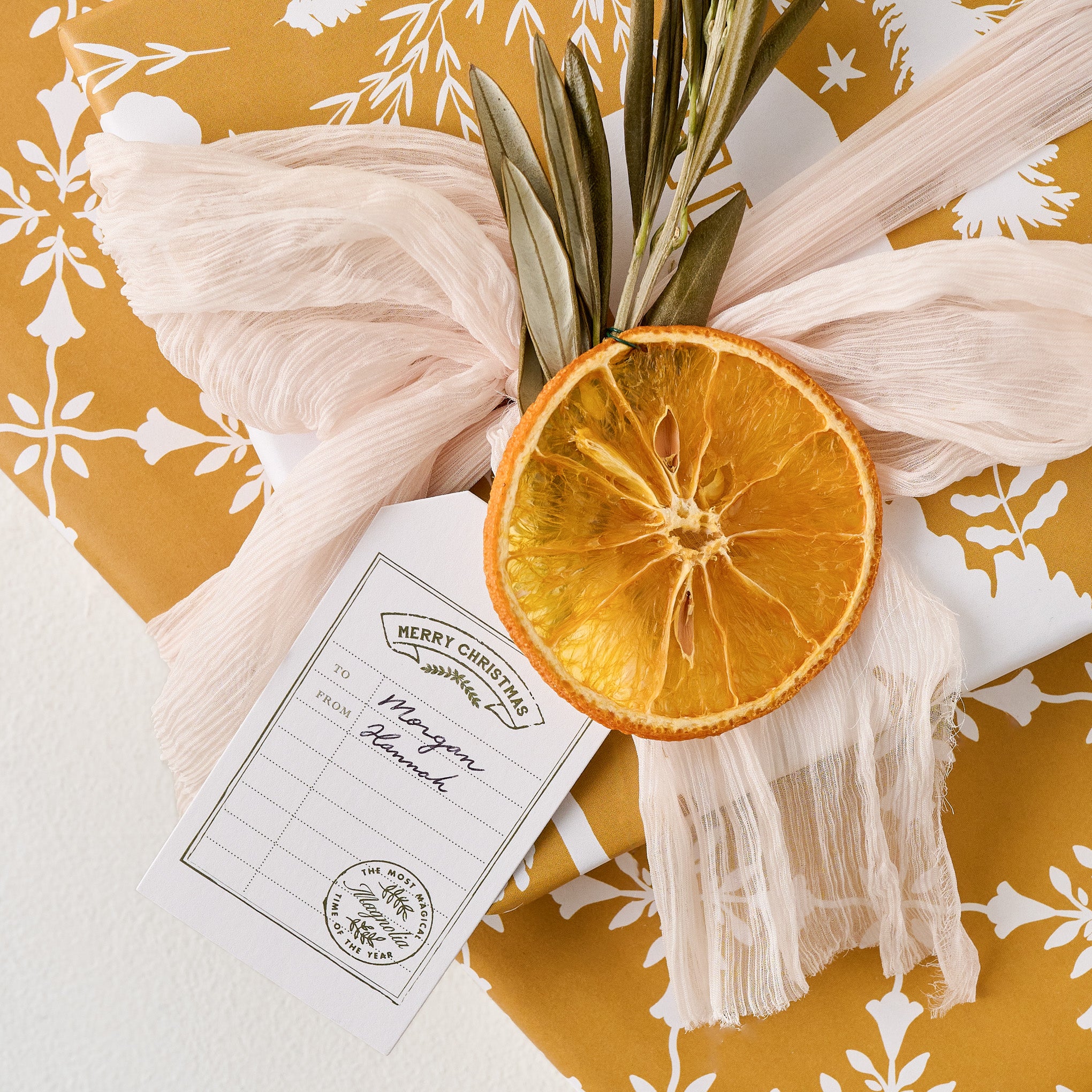 Magnoliass Christmas Gift Tag shown on gift
