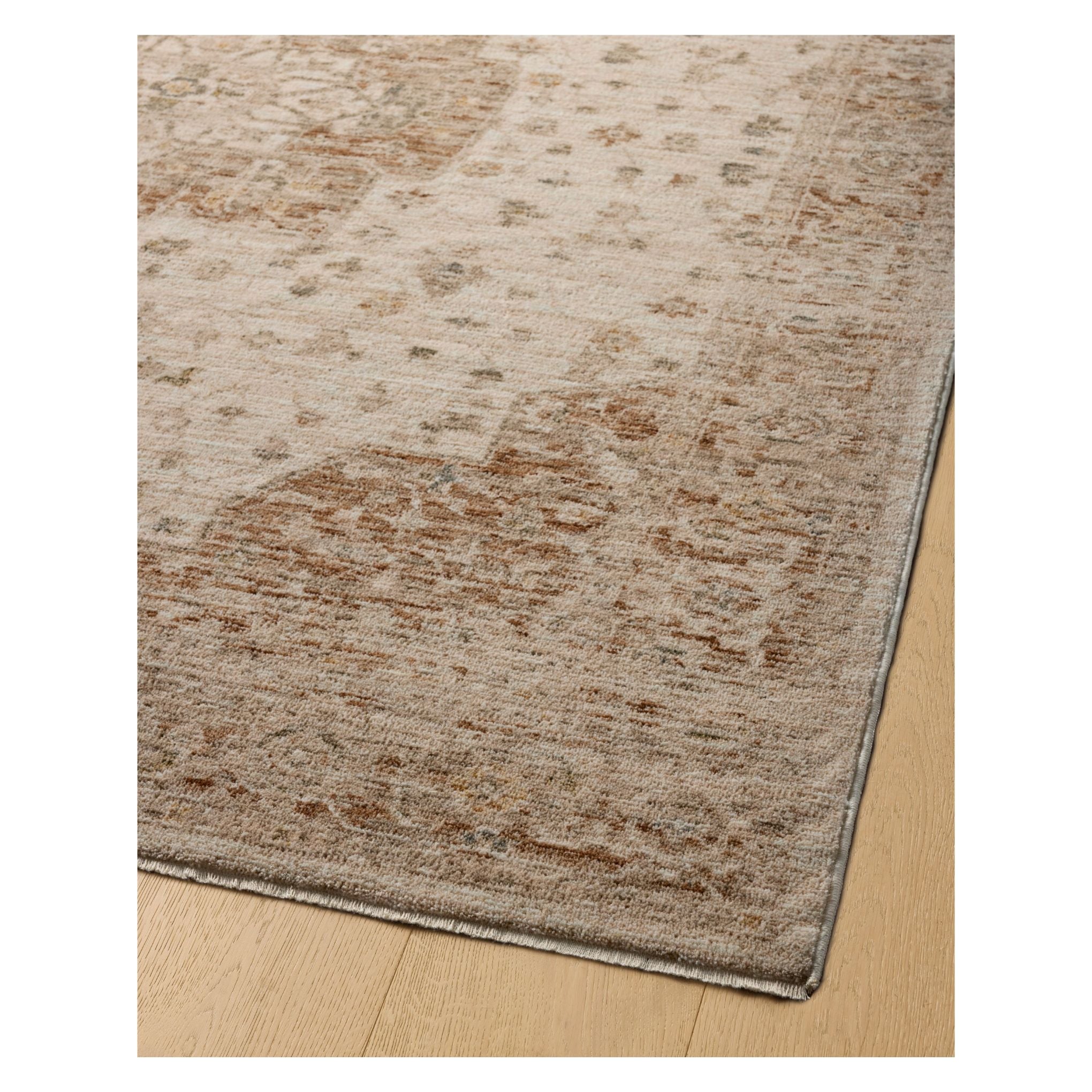 Junie Natural Clay Rug corner shown from a certain viewing angle