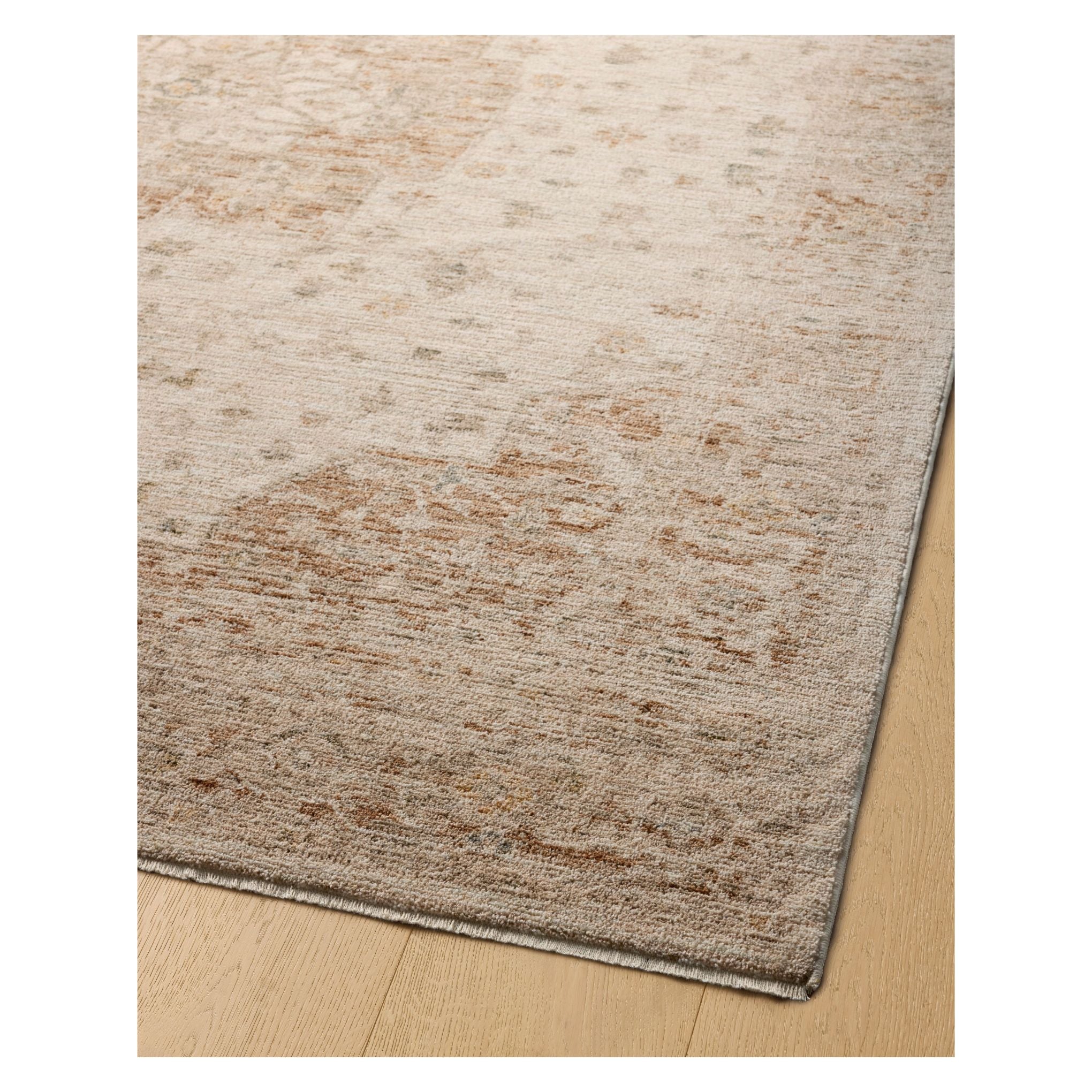 Junie Natural Clay Rug corner shown from a certain viewing angle