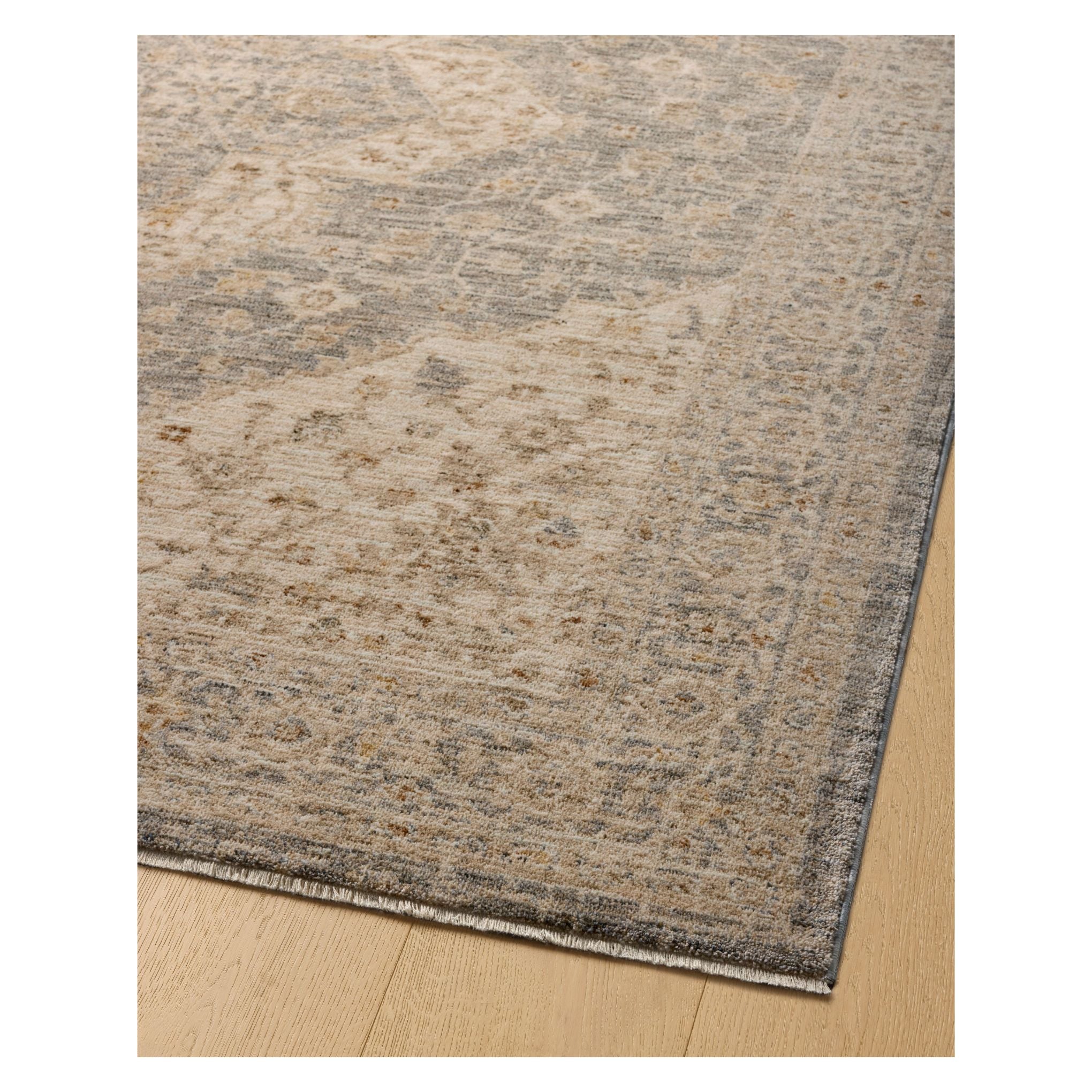 Junie Denim Natural Rug corner shown from a viewing angle