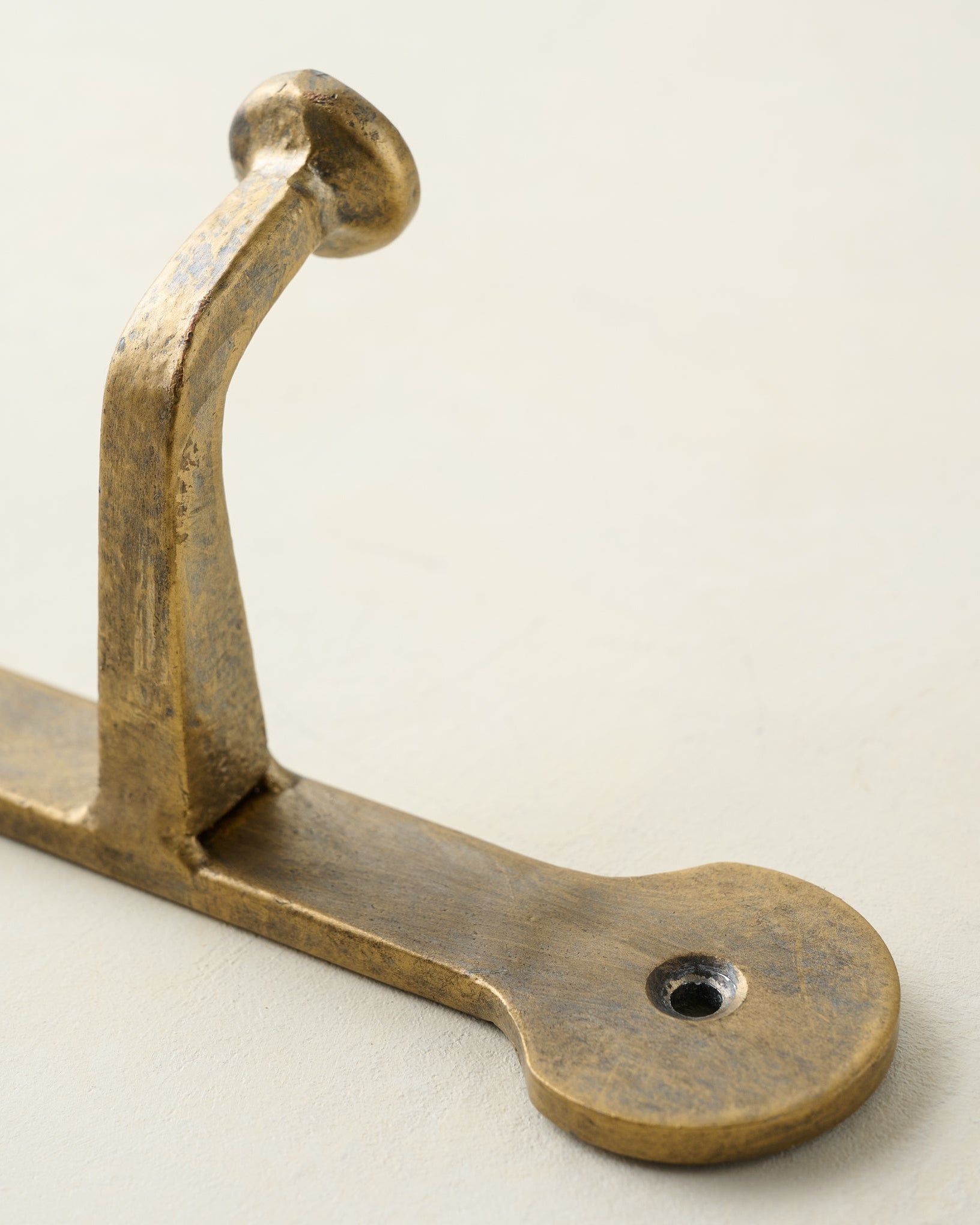 Hammered Iron Wall Hooks close up of hook and hanging screw hole
