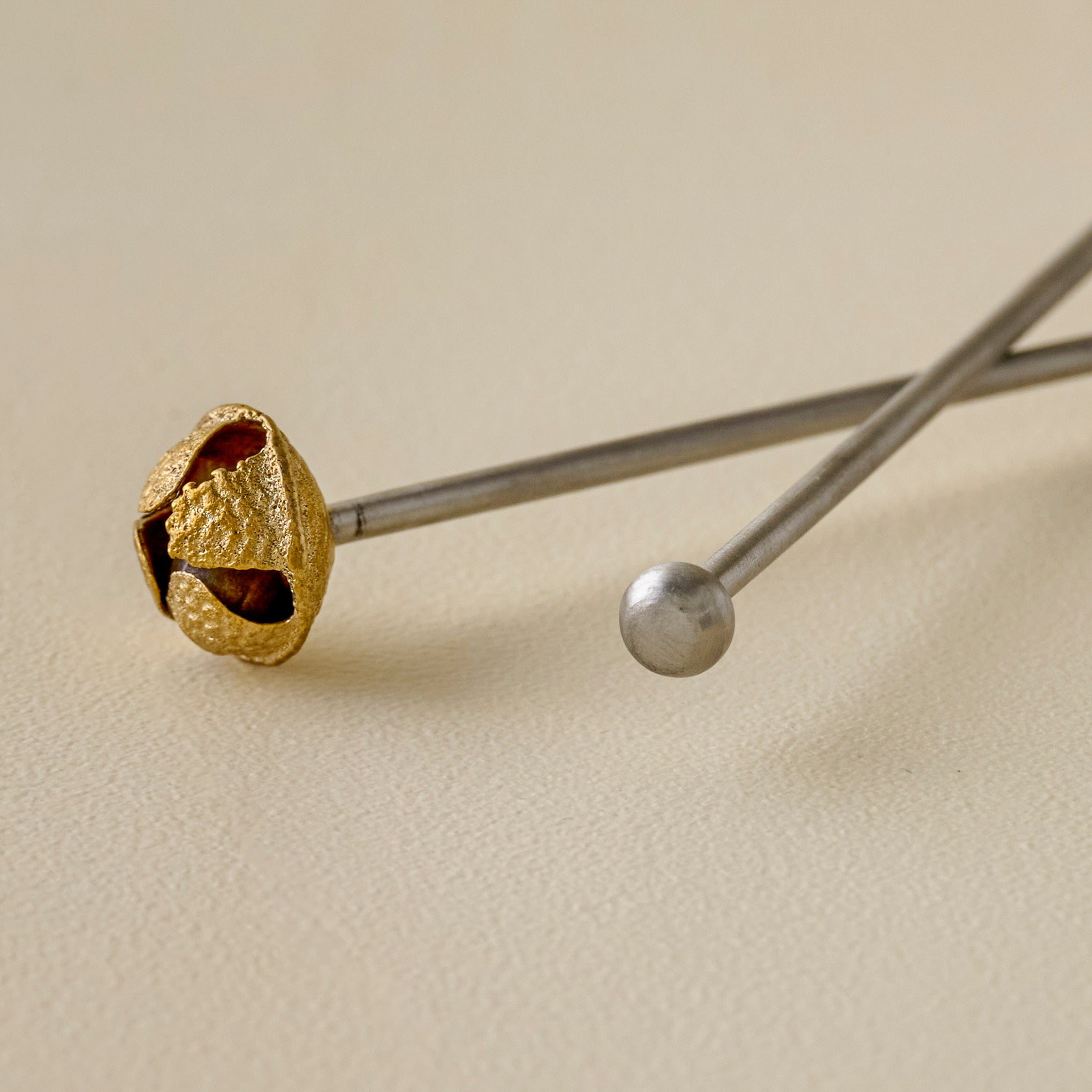Brass Jingle Bell Cocktail Stirrers up close