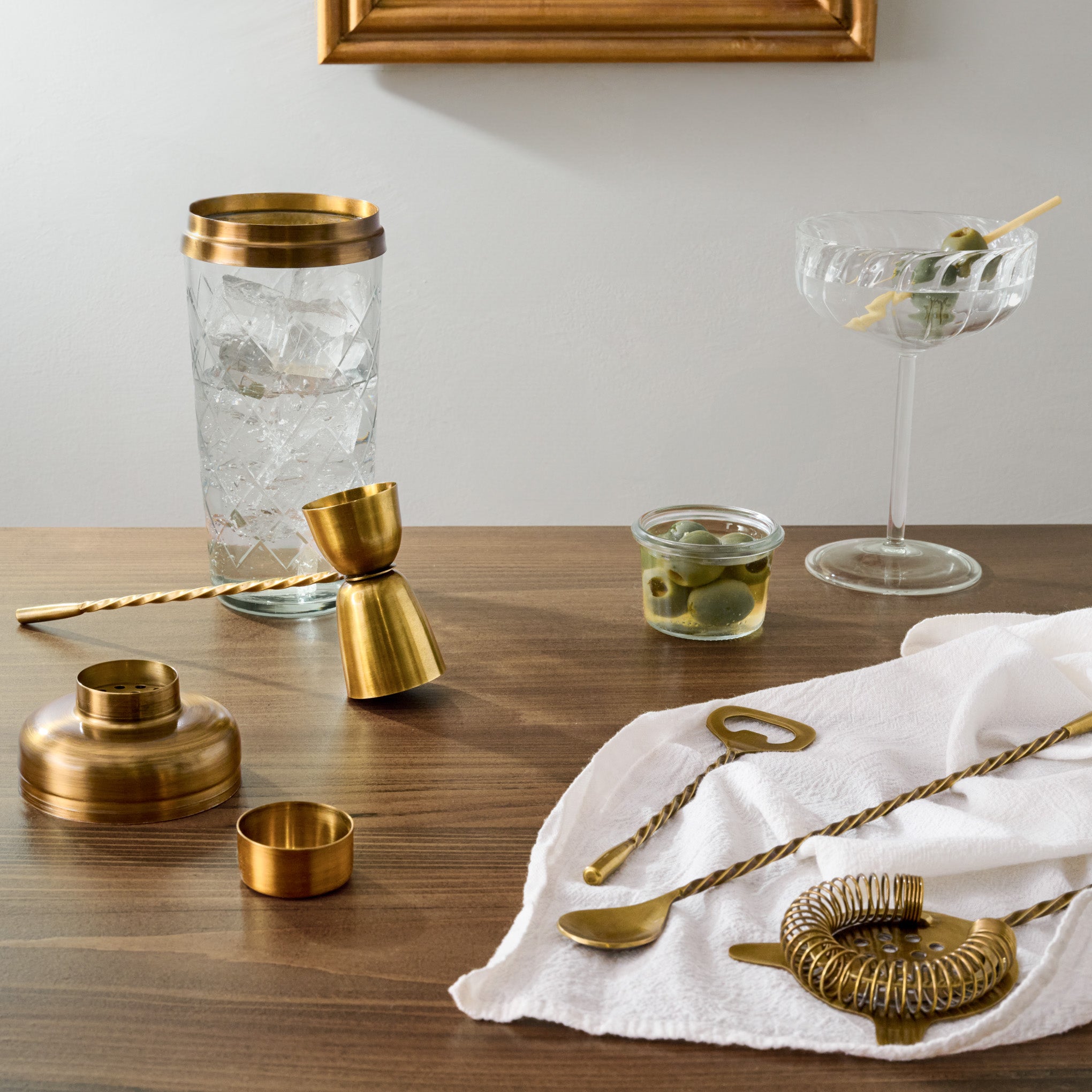 Antique Brass Bar Bundle Pairing shown with drink