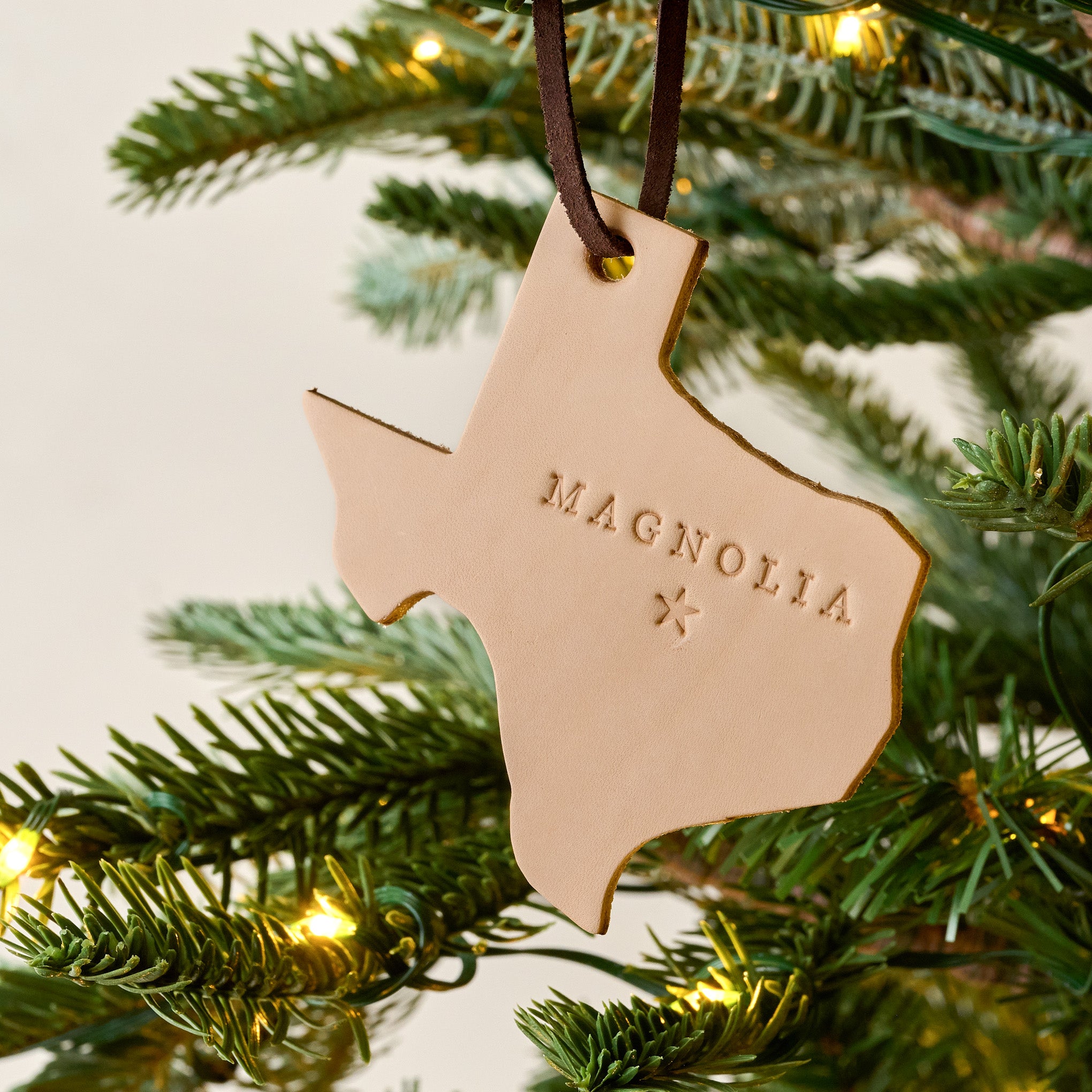 Texas Magnoliass Leather Ornament shown on tree