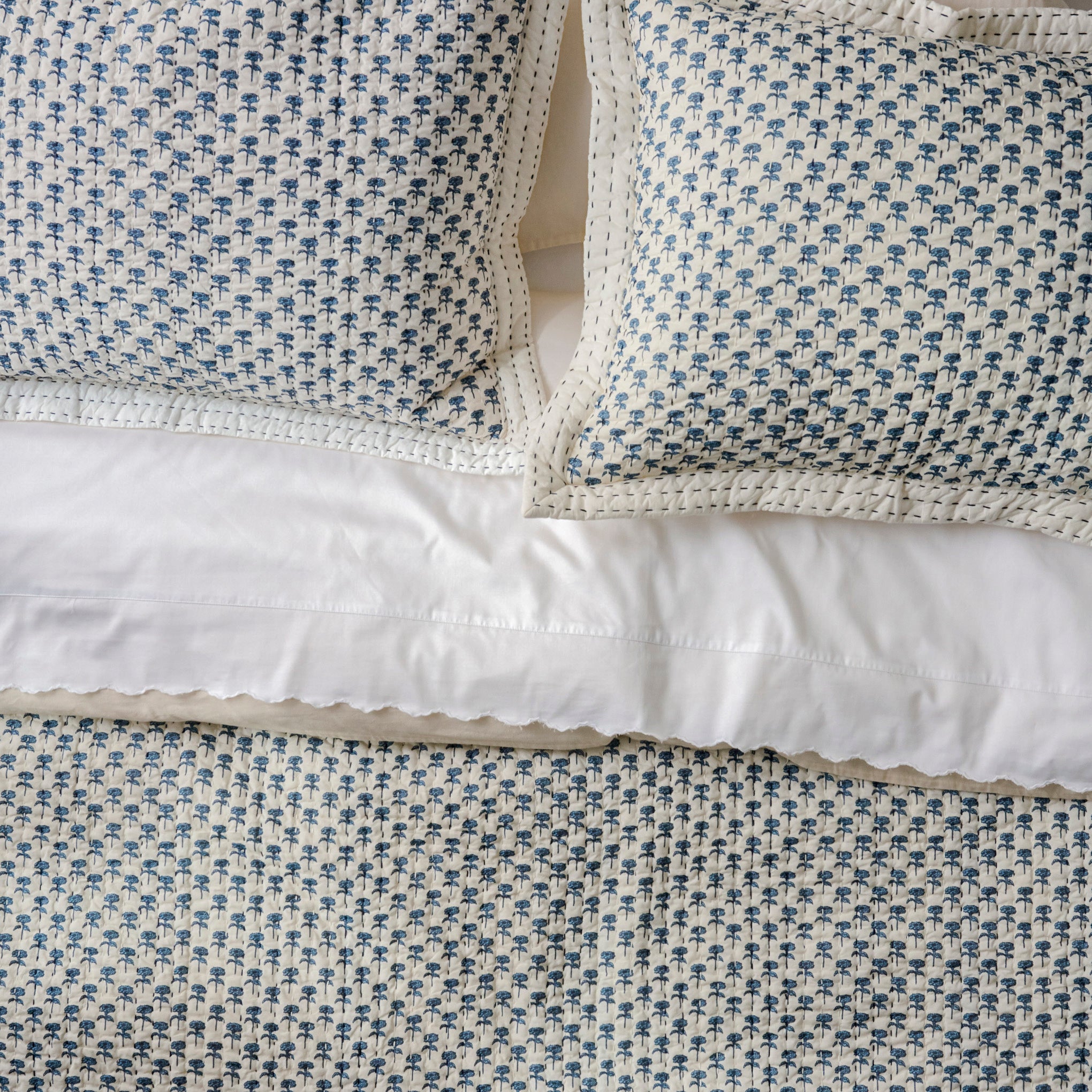 Lilianne Floral Printed Quilt shown on bed with quilt