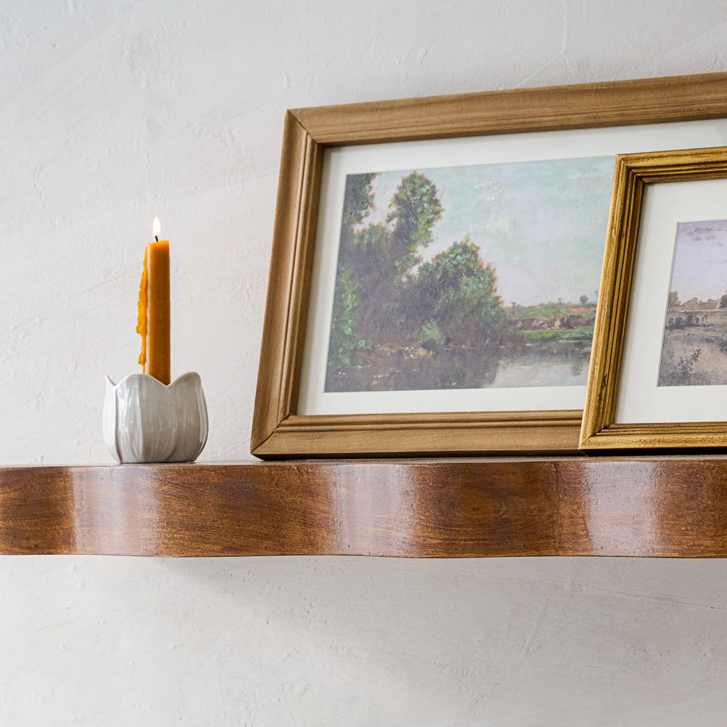 Magnoliass Ceramic Taper Holder on a wall shelf