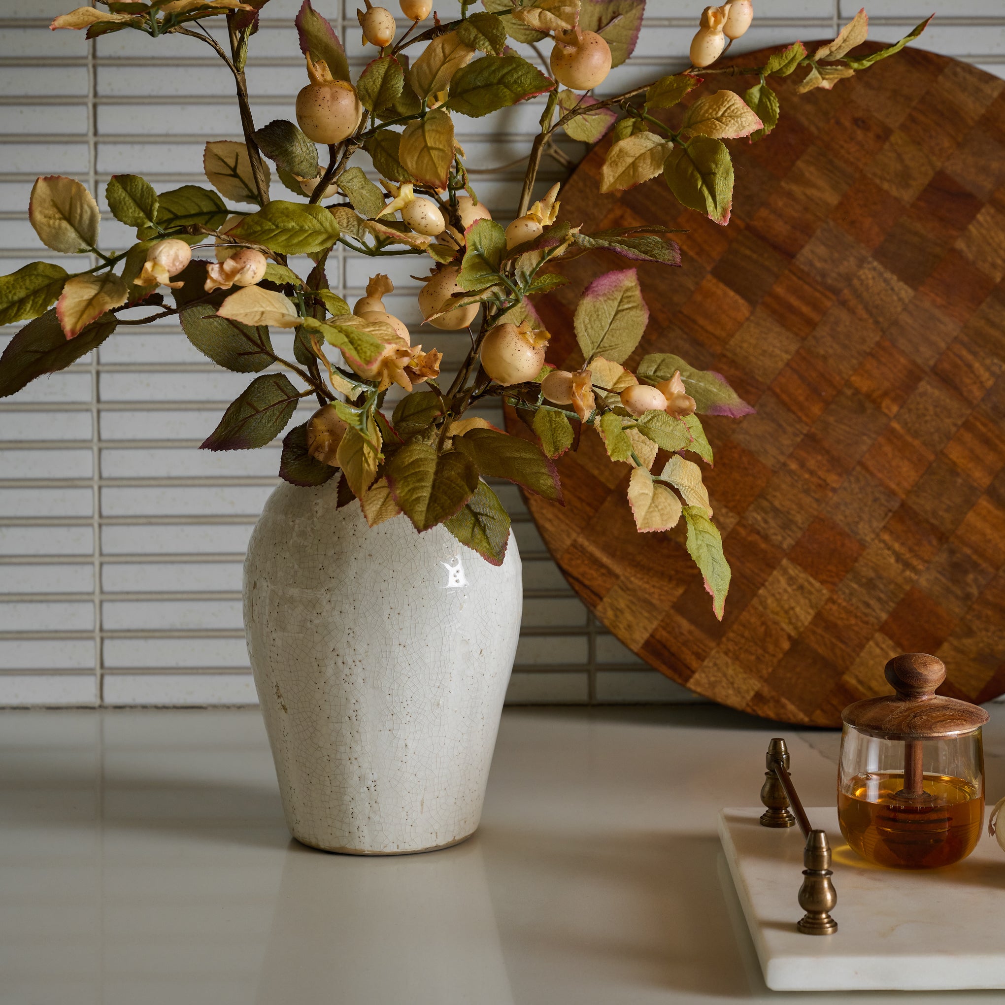 Marie Distressed Crackle Vase on a counter with pear florals