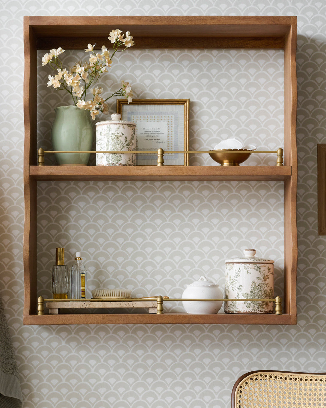 Both sizes of Green and White Distressed Canister on a shelf in a bathroom