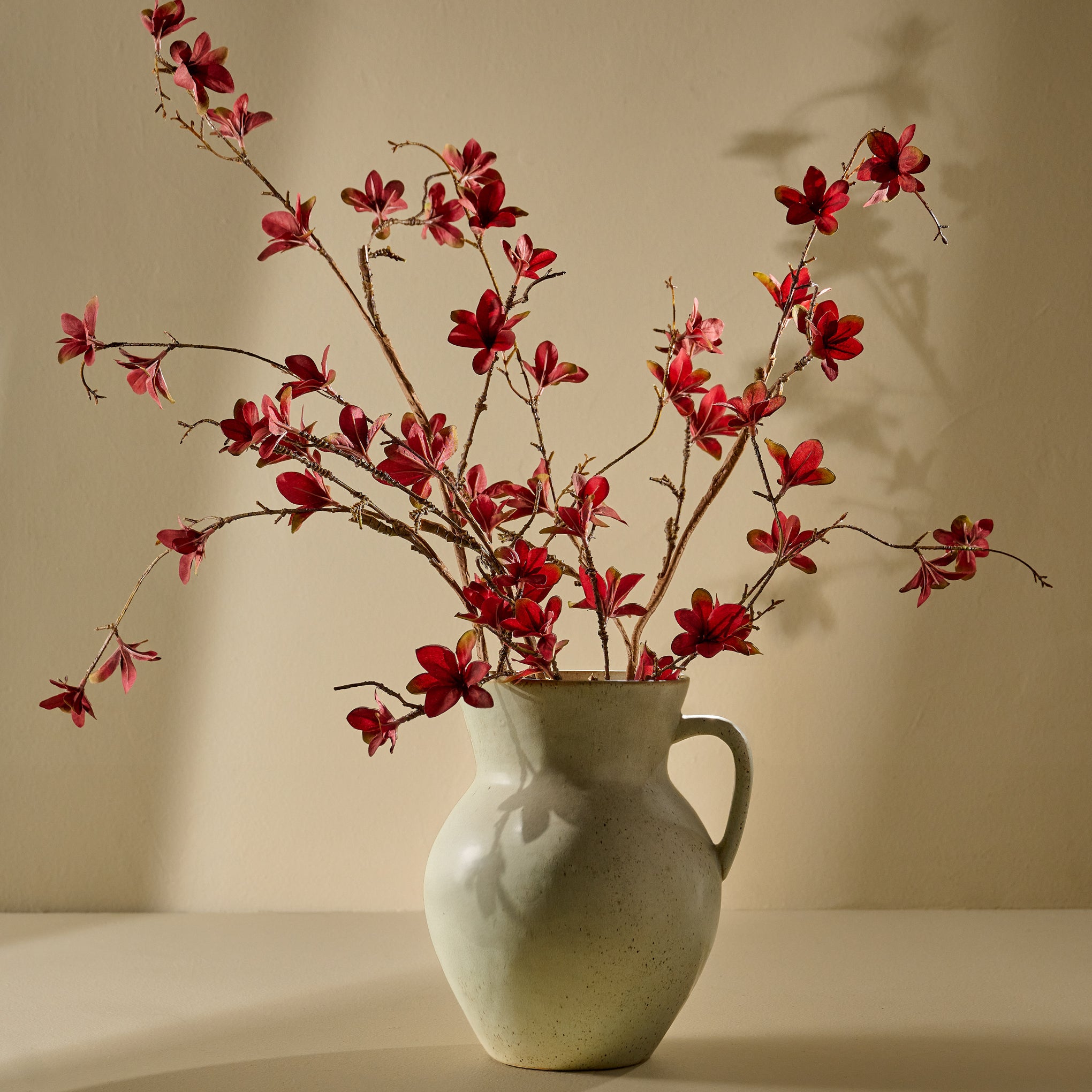 Large Magnoliass Bloom Spray shown in green vase