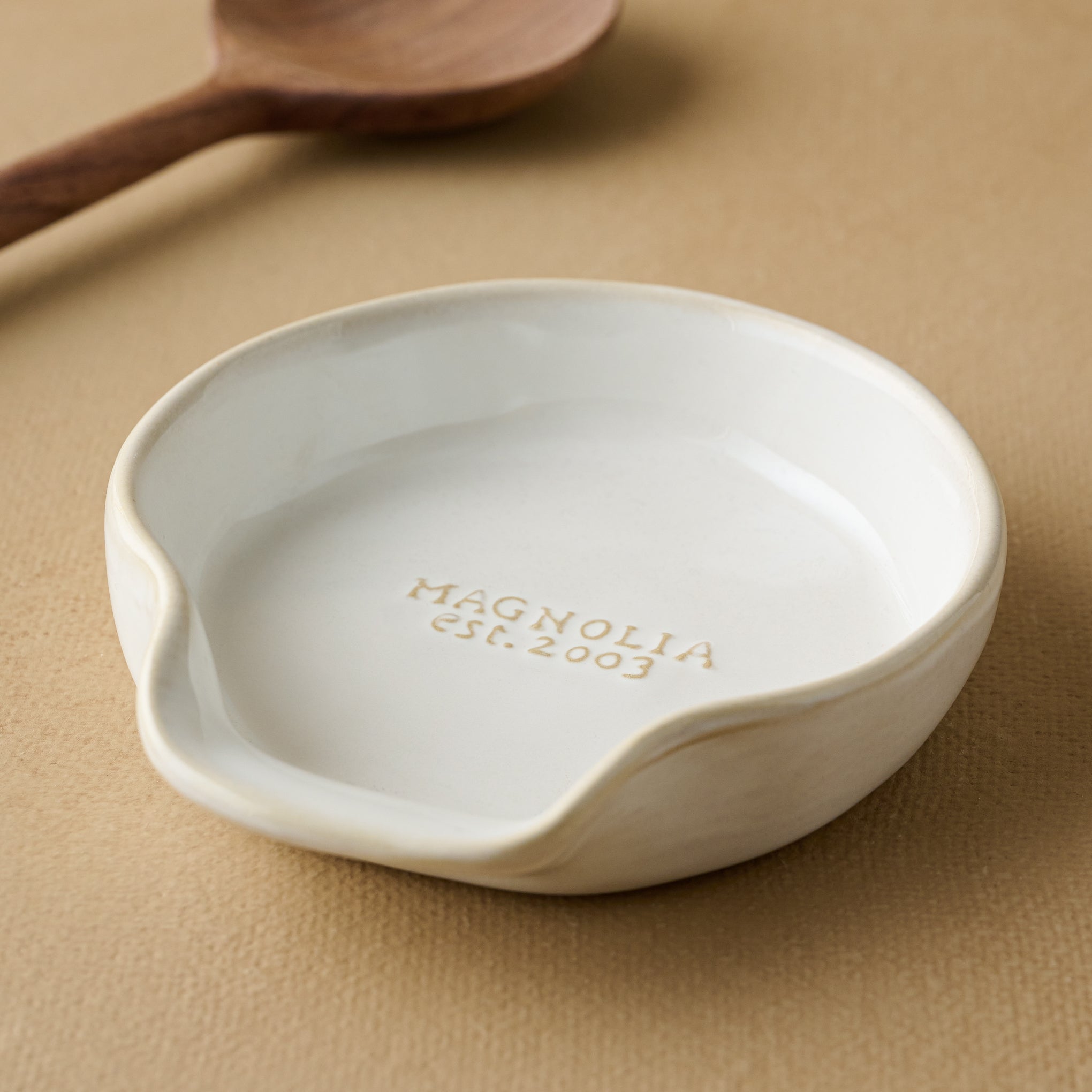 Magnoliass Est. Spoon Rest with spoon in the background