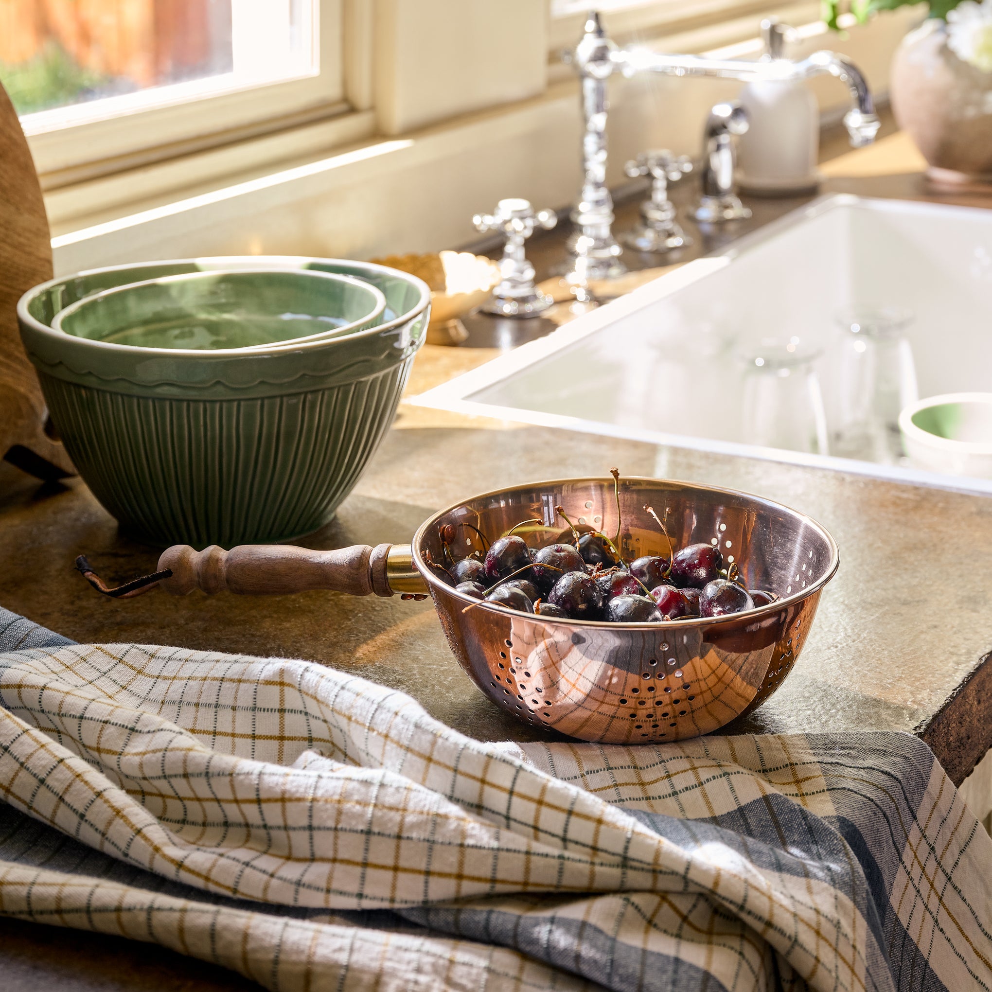 Vintage-Inspired Green Mixing Bowl Set of Two stacked within each other on a countertop