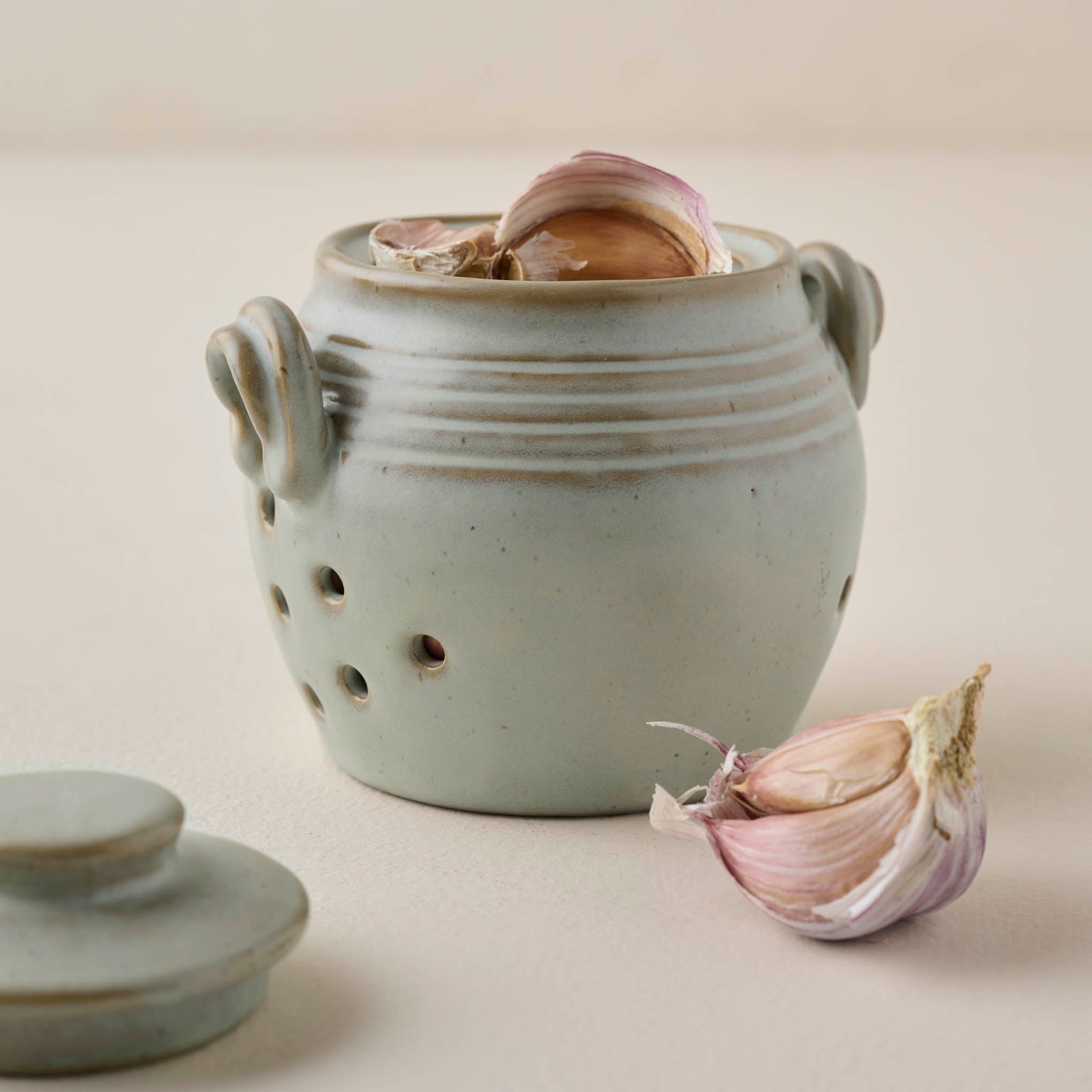 French Grey Garlic Keeper shown with garlic