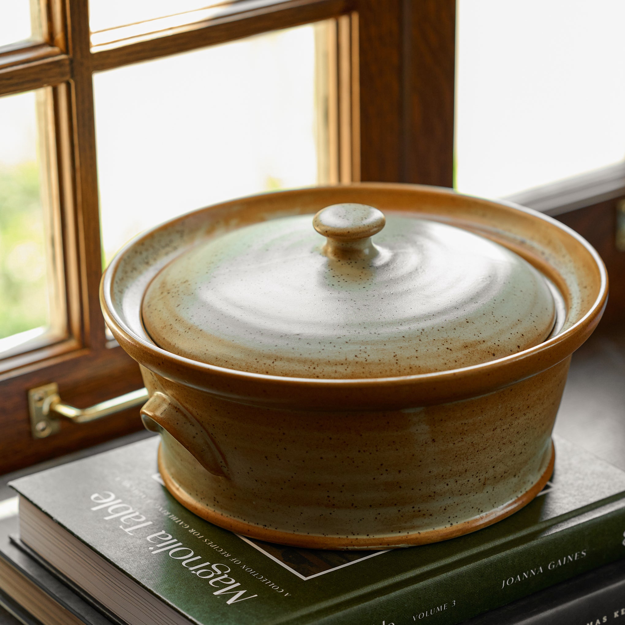 French Grey Reduction Fire Baker on top of Magnoliass table cookbook volume 3