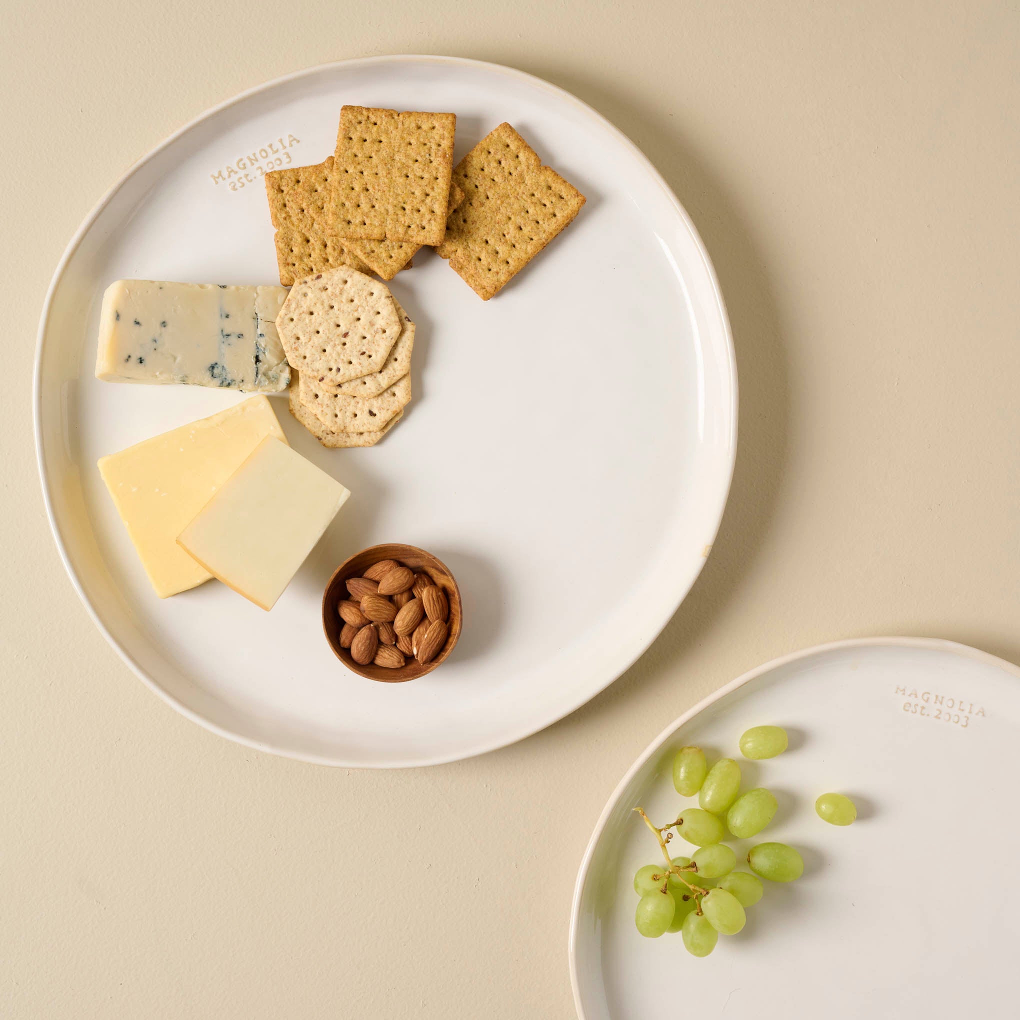 Magnoliass Est. Ceramic Round Platter with cheese and crackers