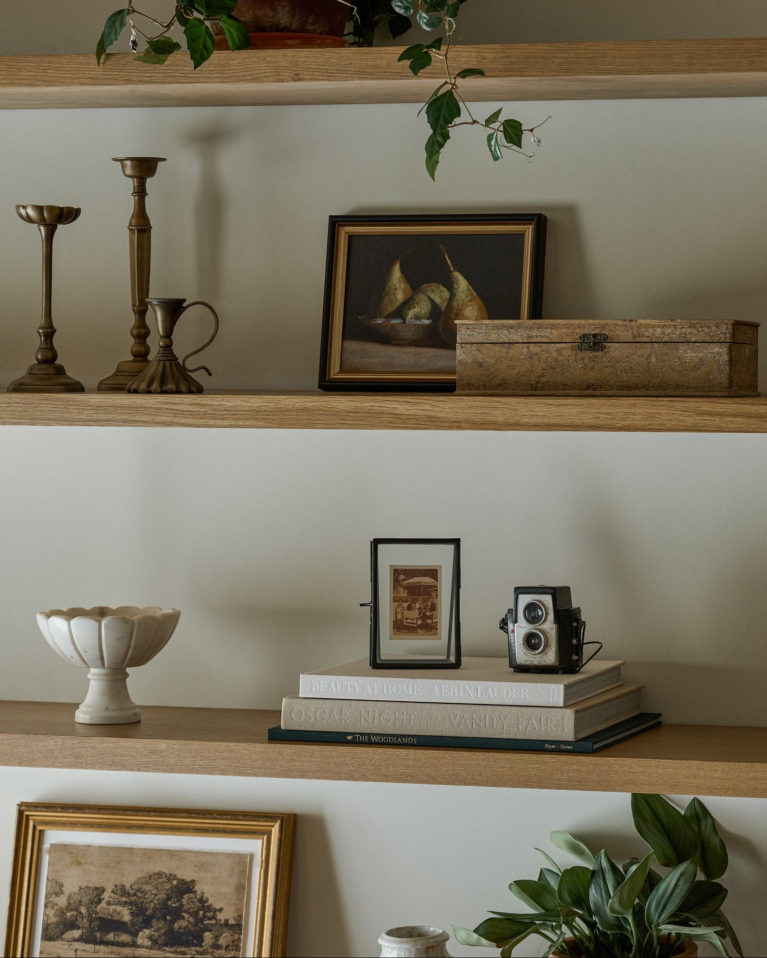 Marble Scalloped Accent Bowl on open shelving with various decor