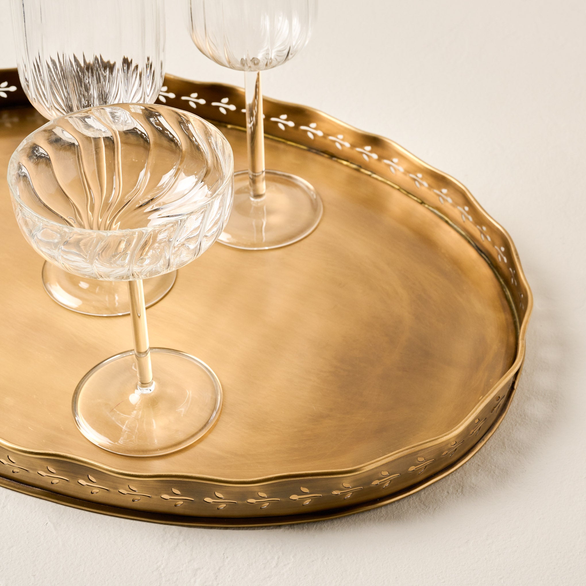 Floral Antique Brass Tray shown with empty glasses on top