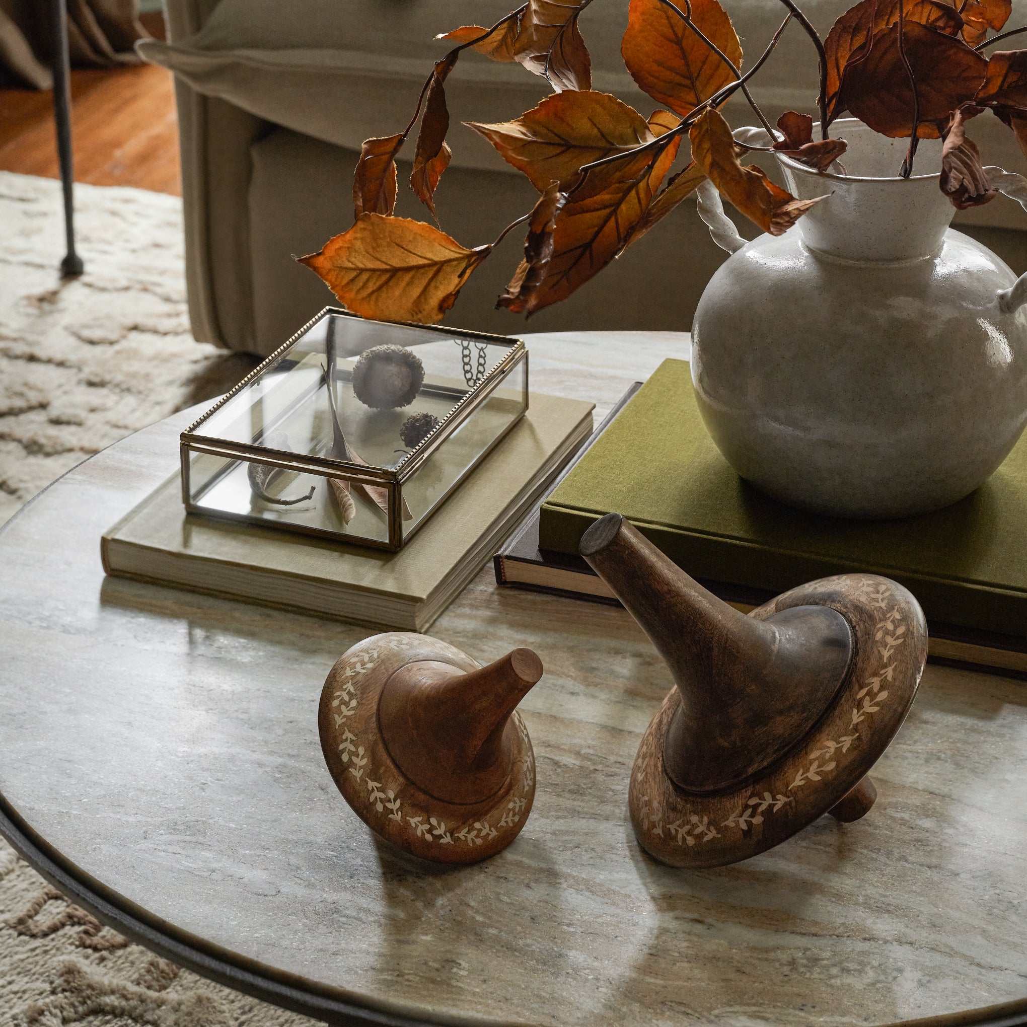 Small and Large Etched Wood Spinners shown on coffee table