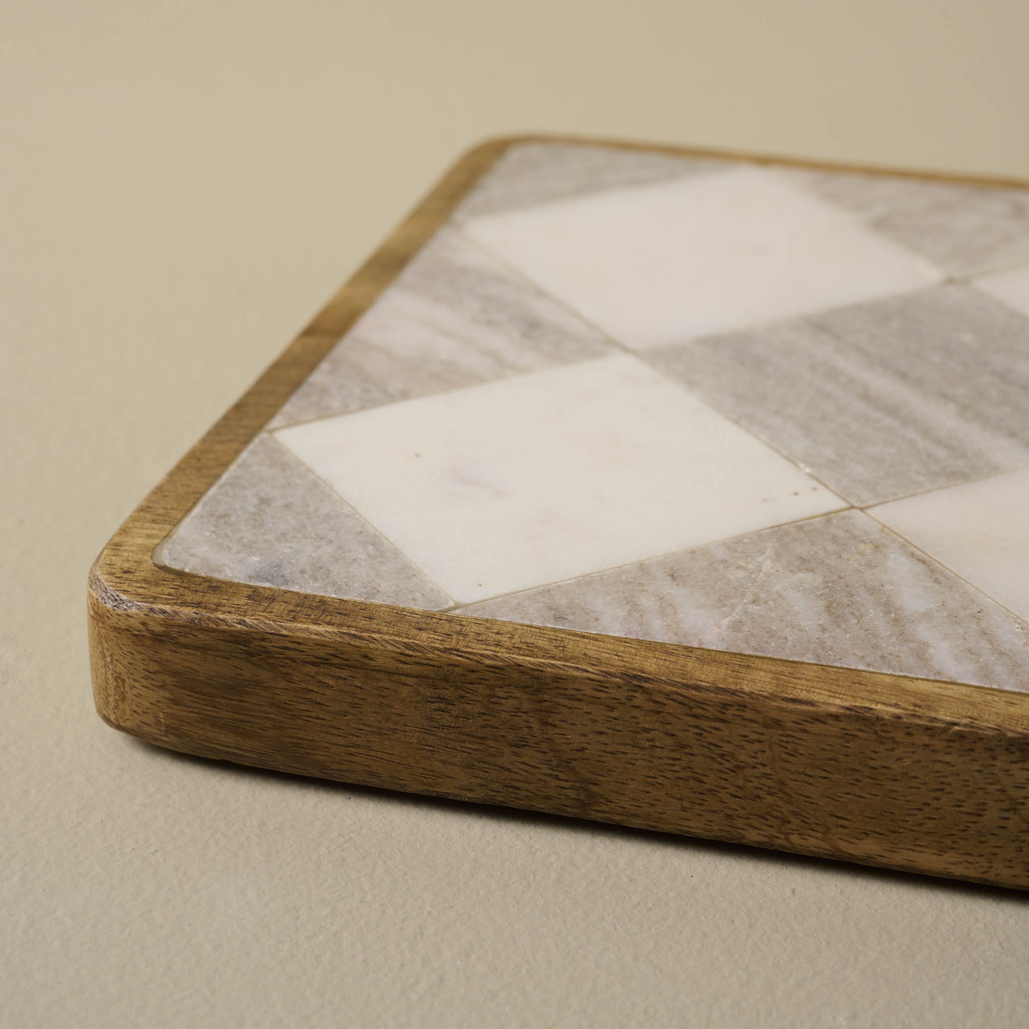 Everett Checkered Marble Trivet at a low angle