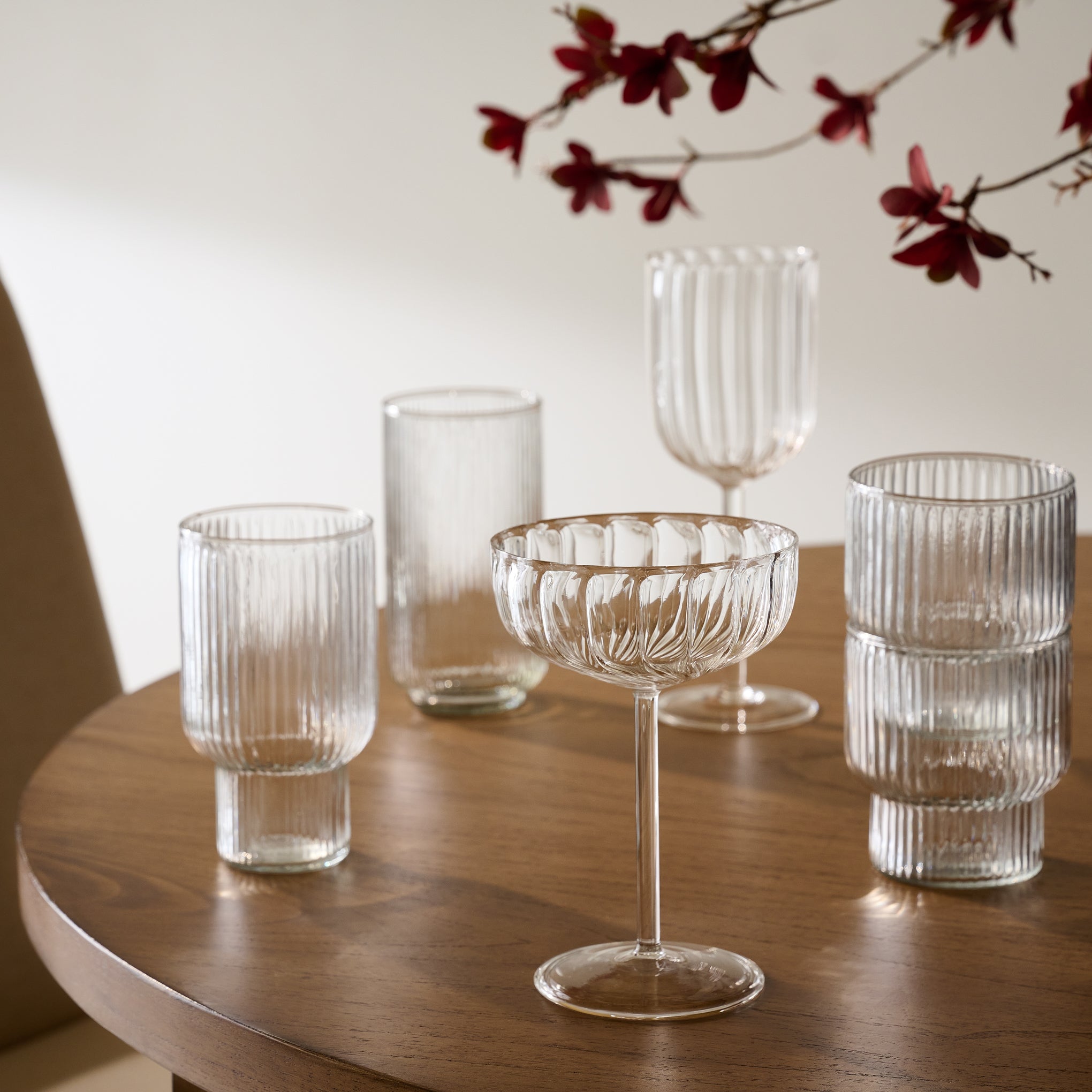 Atlas Ribbed Stacking Glass Tumblers shown with other glasses