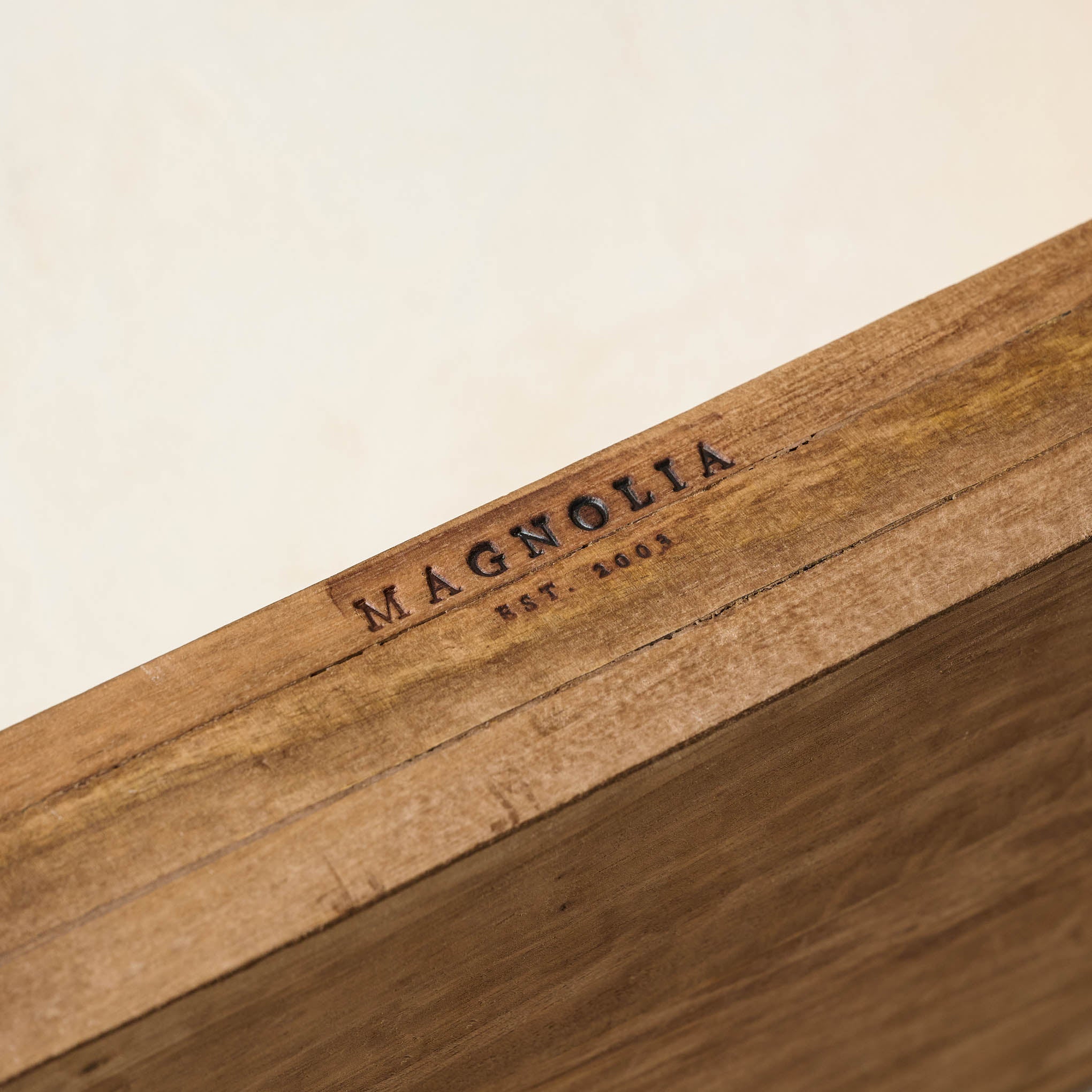 Griffin Hand Carved Wood Shelf Magnoliass logo branded onto the wood