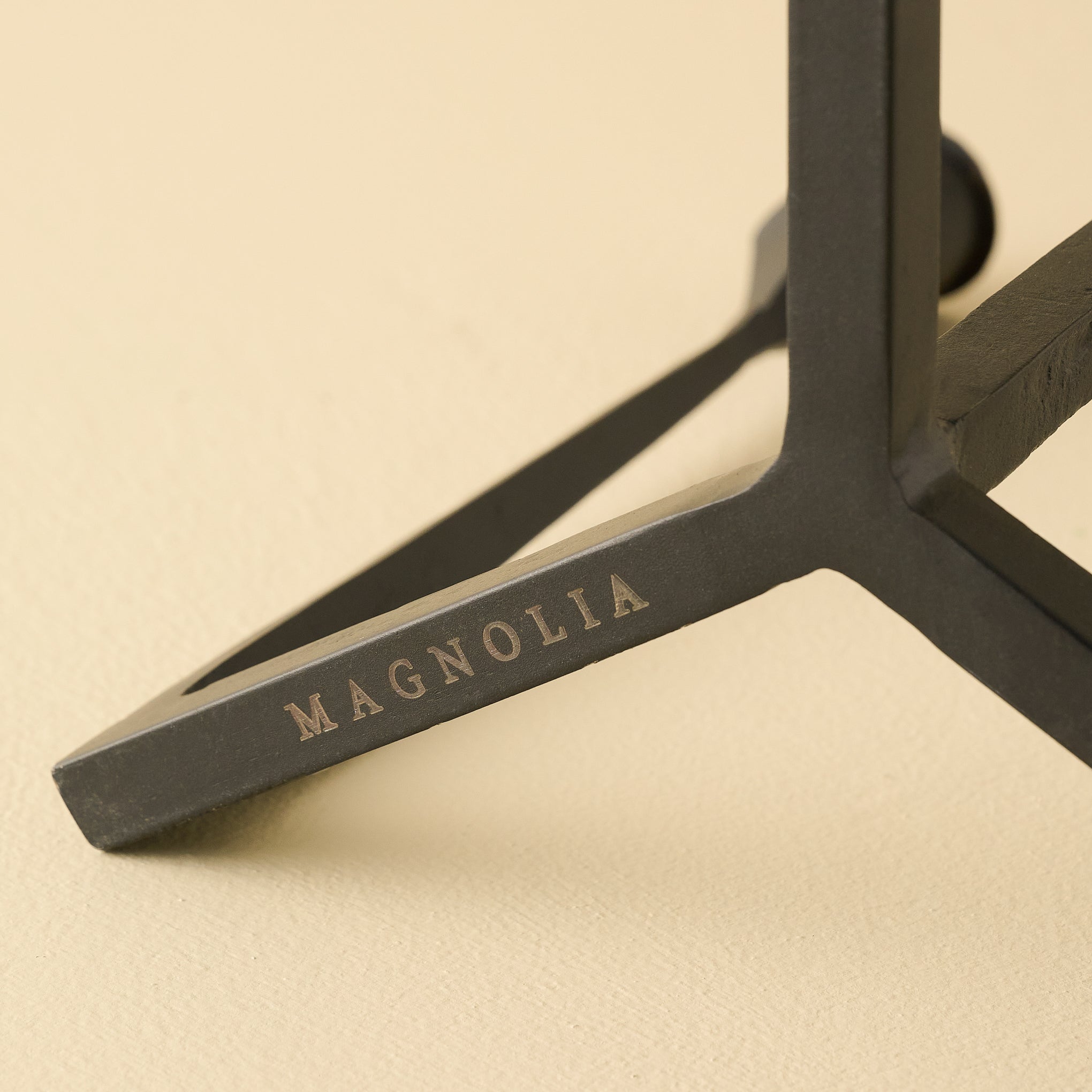 Black Gatecrest Multi Taper Holder close up of Magnoliass logo on bottom