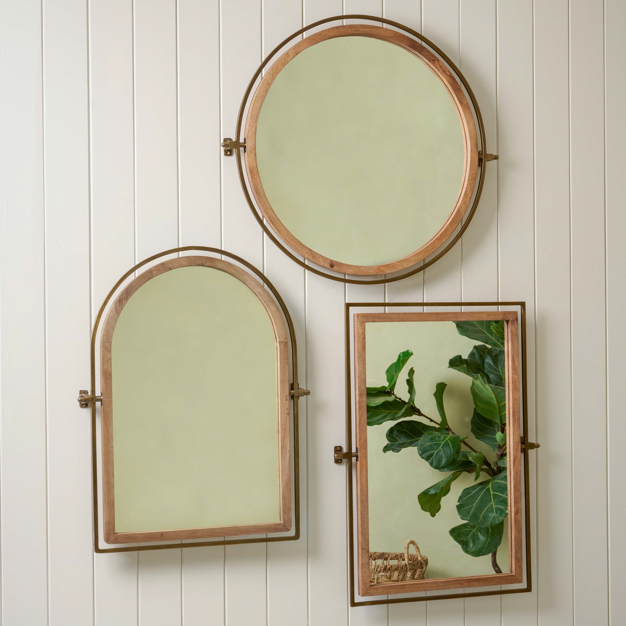 Flora Rectangle Mirror on a wall with other flora mirrors