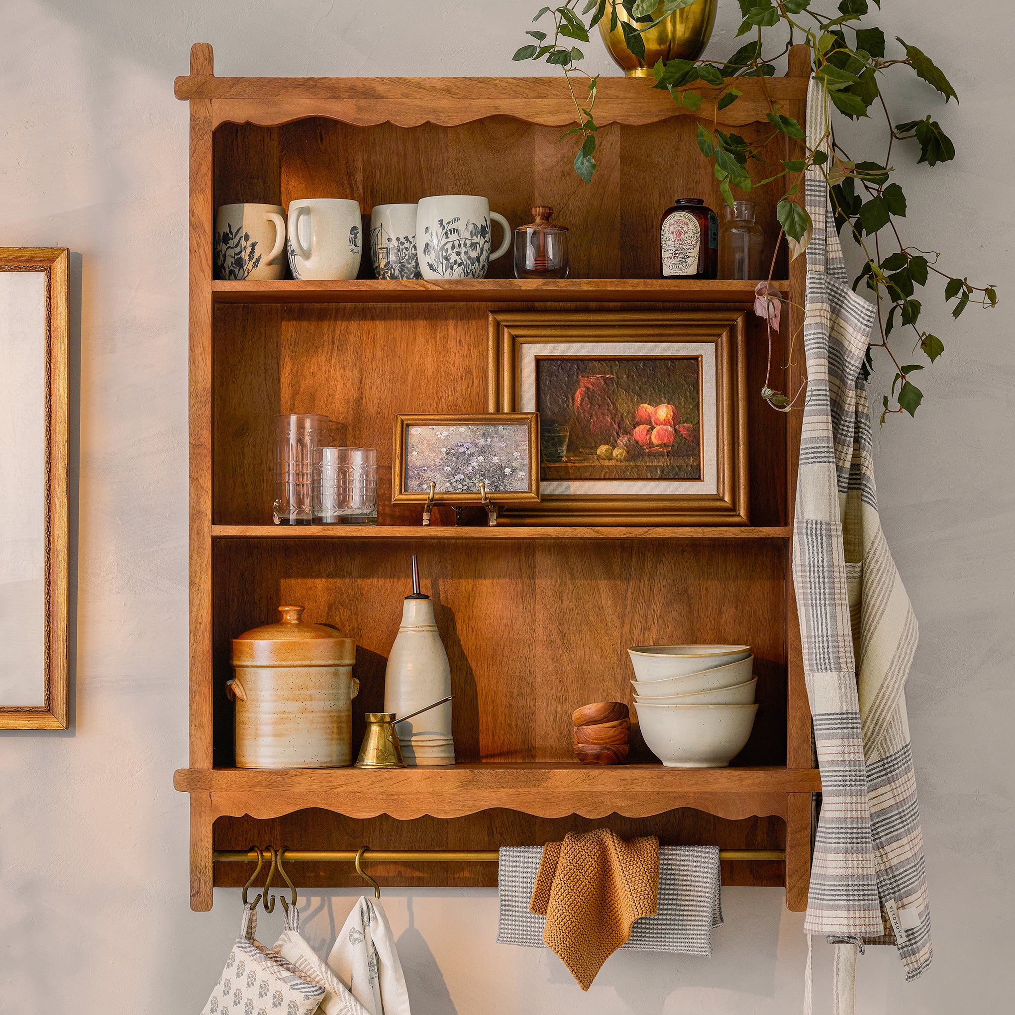 Daphne Wooden Wall Shelf with items on shelf