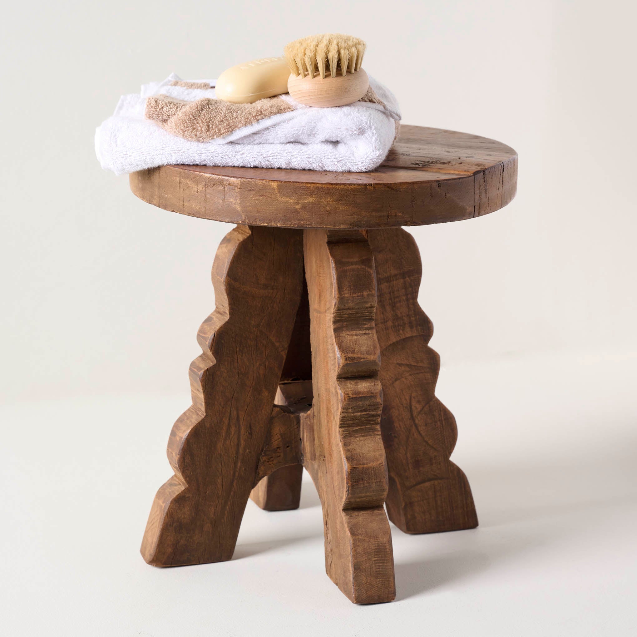 Reclaimed Wood Stool shown holding bathroom accessories