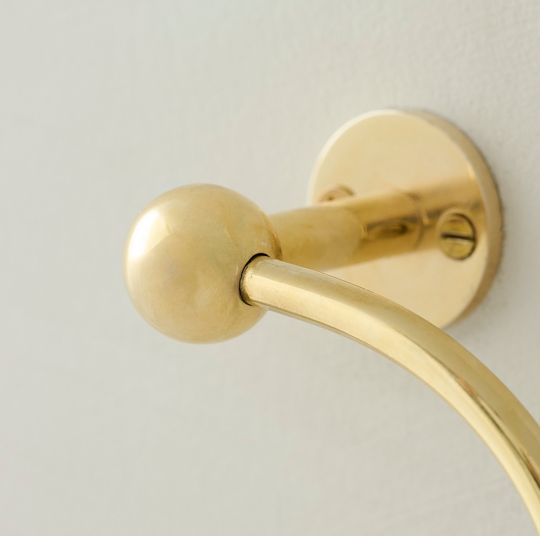 Jules Brass Toilet Paper Holder up close