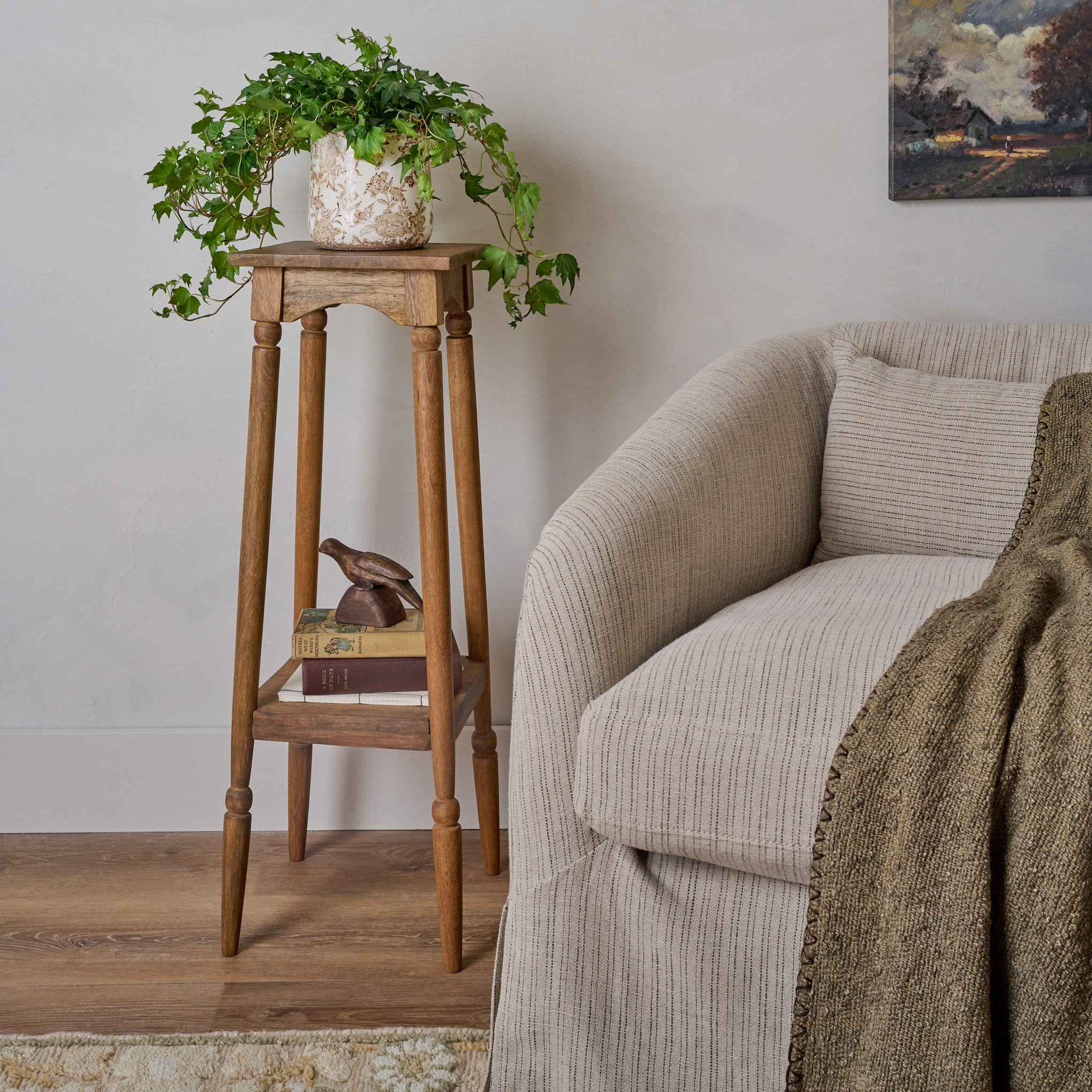 Brown and White Distressed Planter shown on plant stand