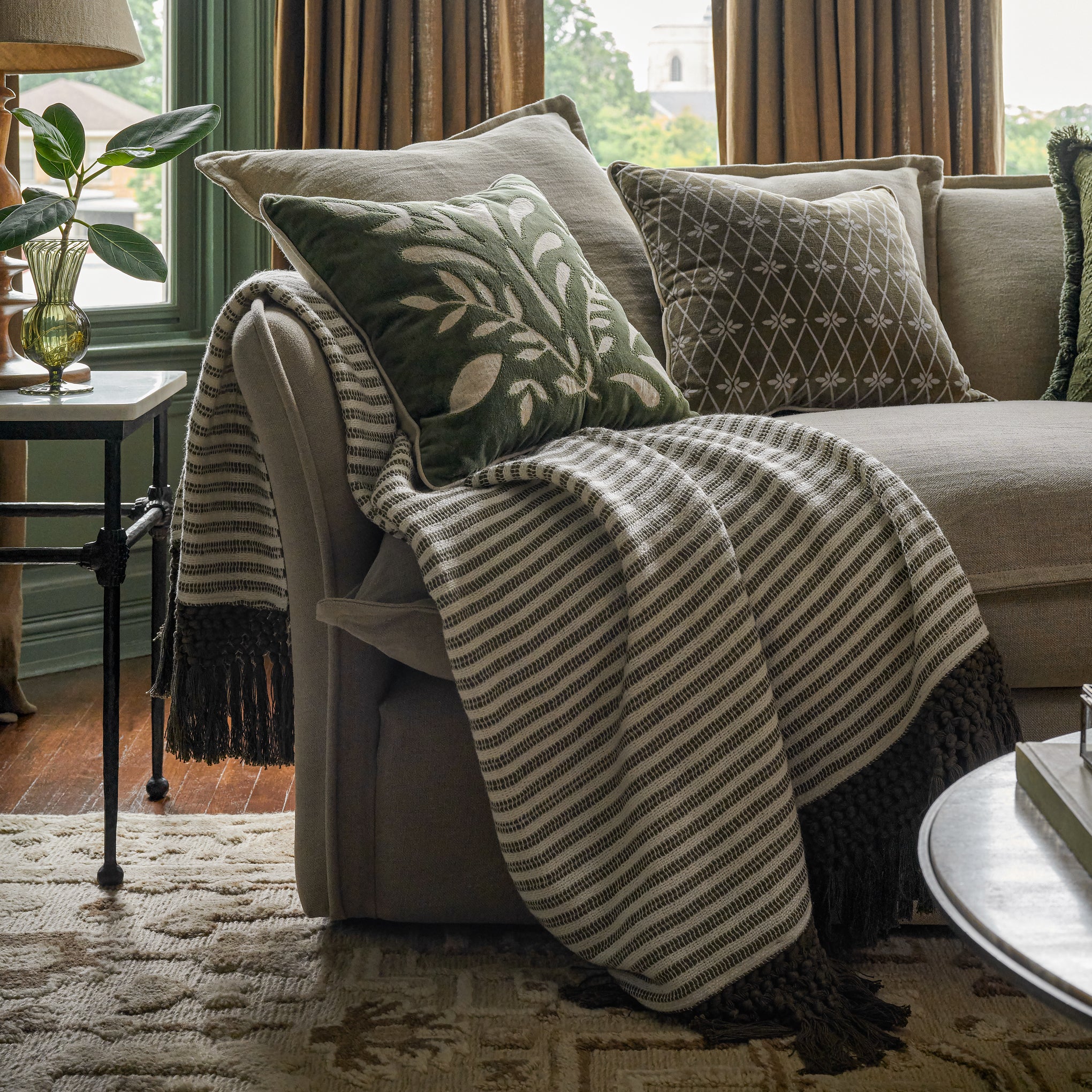 Essential Tassel Throw - Green Striped shown on couch