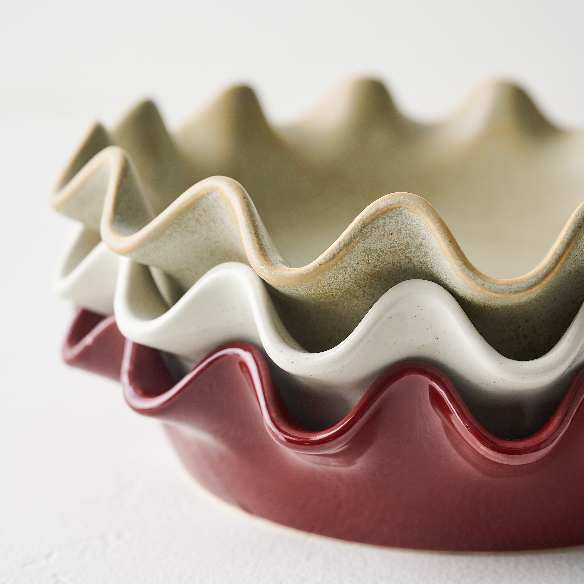 Cream Speckled Pie Dish up close shown stacked with pie dishes