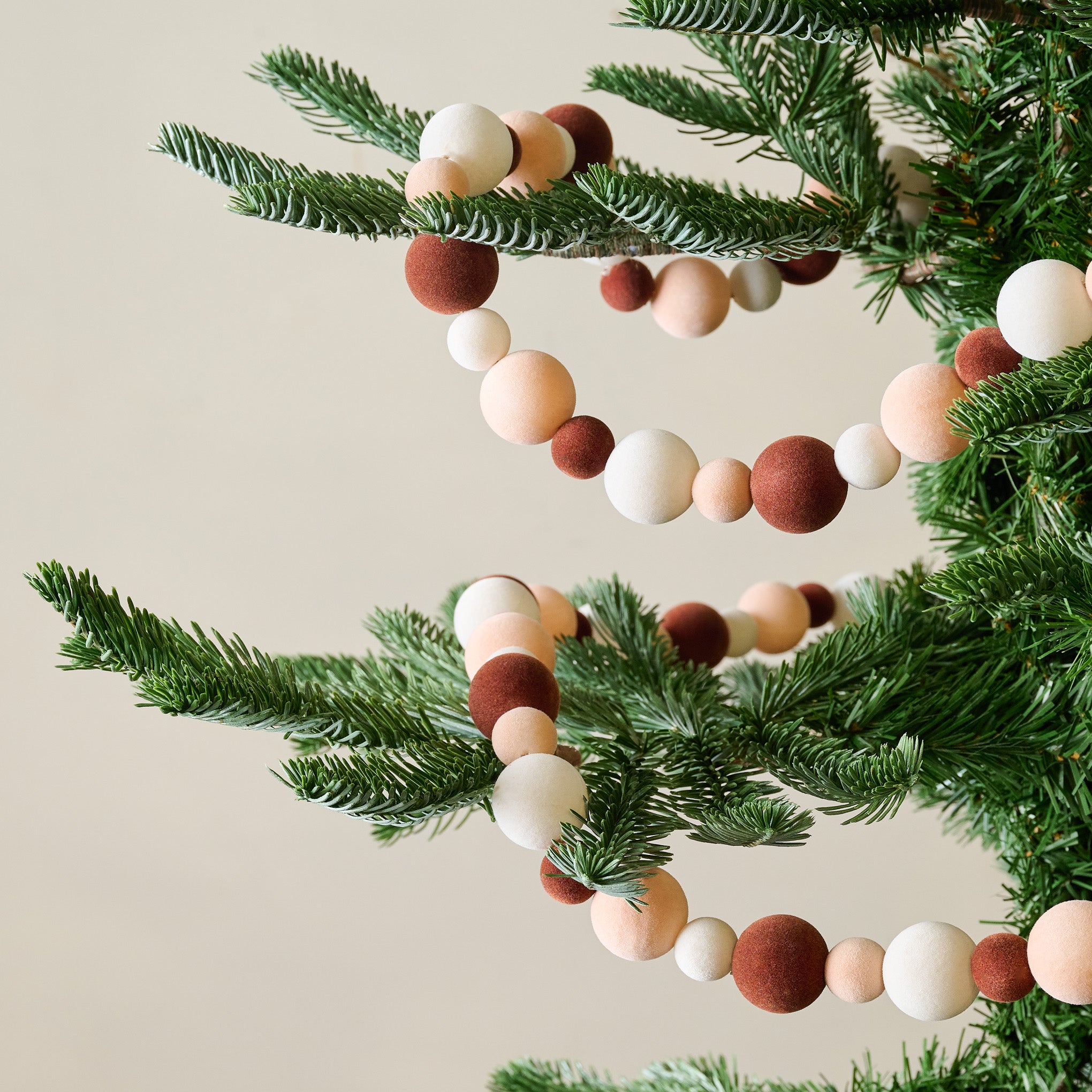 Warm Colorful Flocked Garland shown on tree