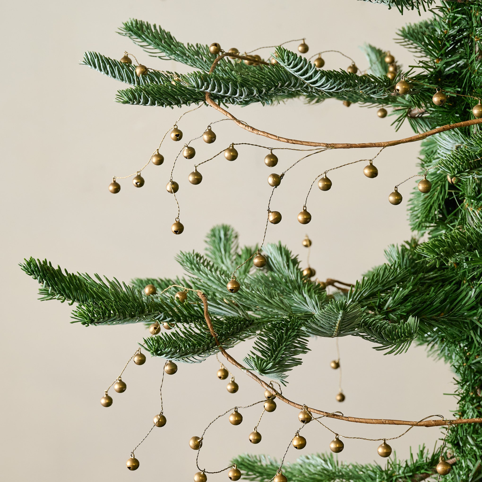 Micro Jingle Bell Garland shown on tree