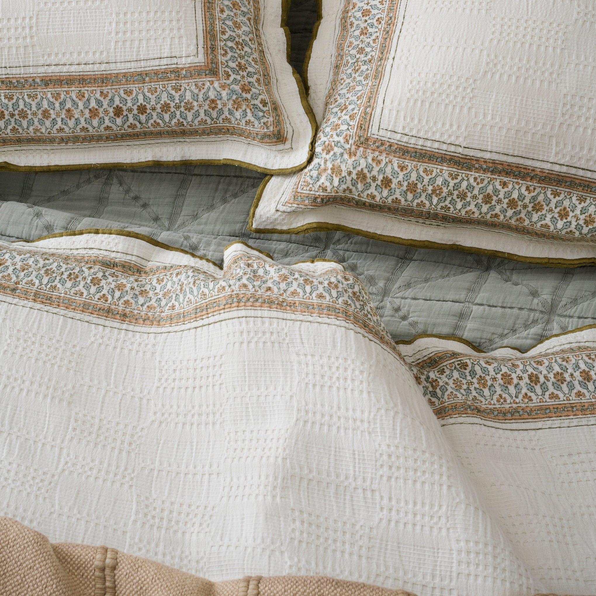 Clemence Block Print Duvet shown on bed with shams