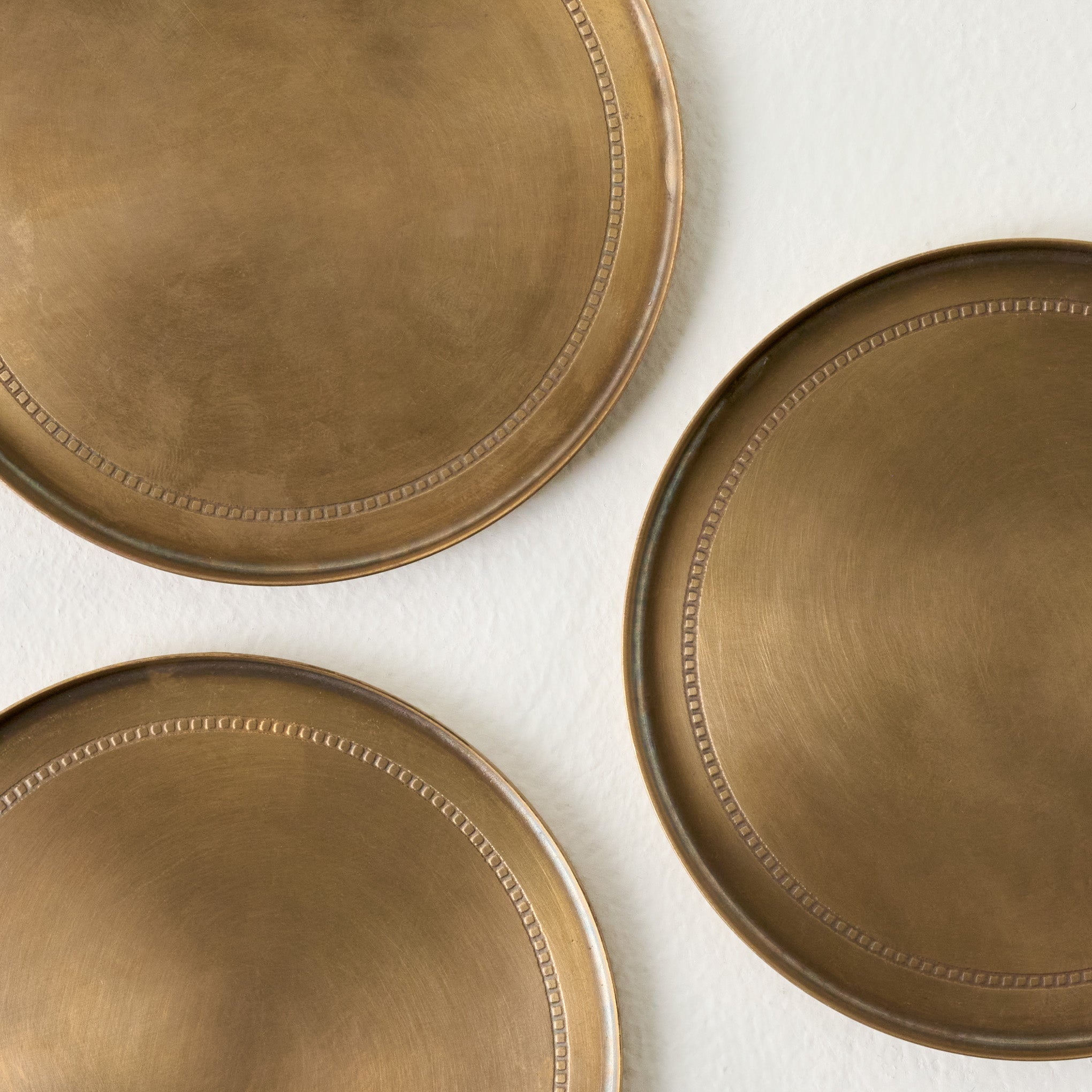 Magnoliass Etched Brass Coaster Set of Four up close