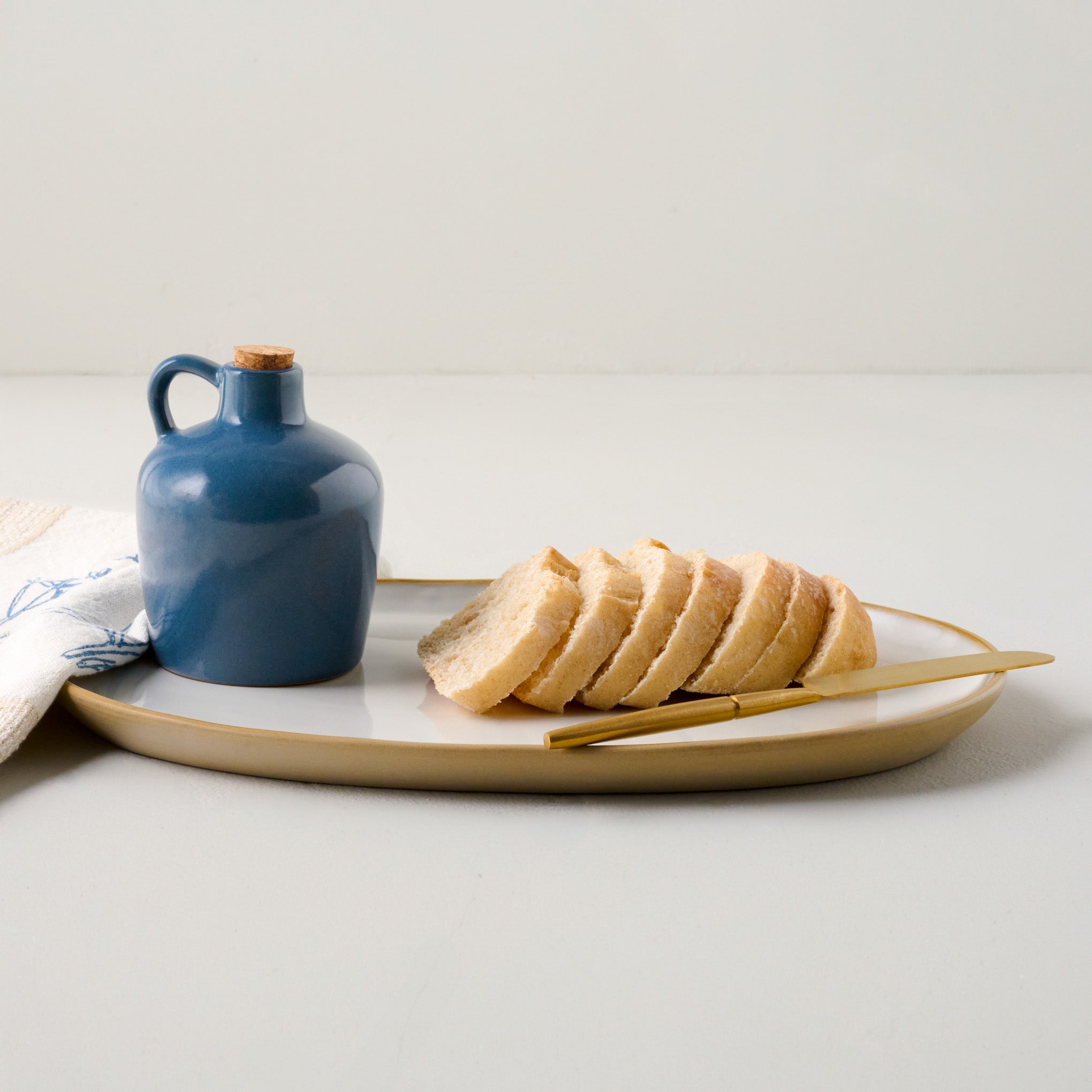 Stone White Lakelynn Serving Platter shown with bread 