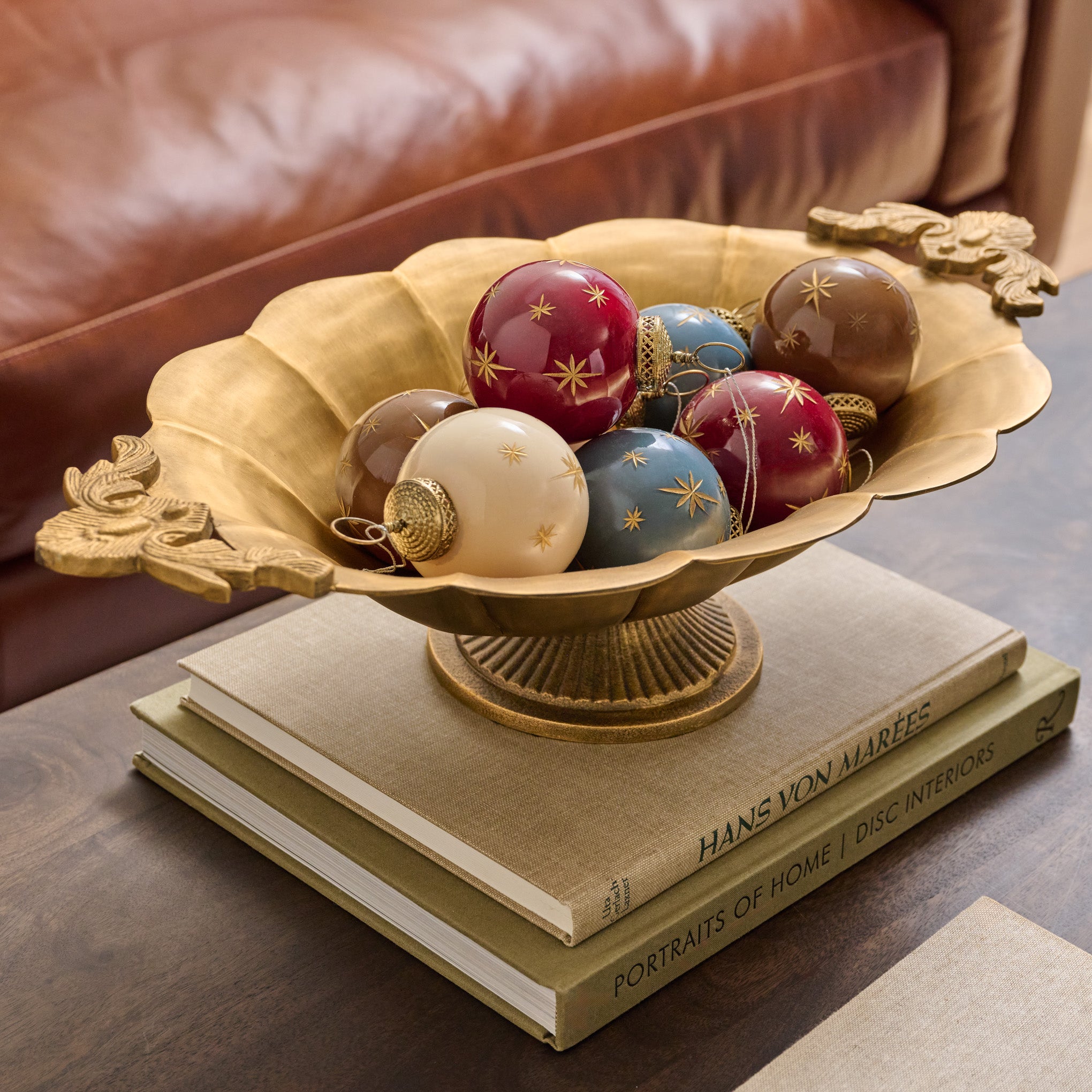 Oversized Ornate Brass Pedestal Bowl shown styled with ornaments