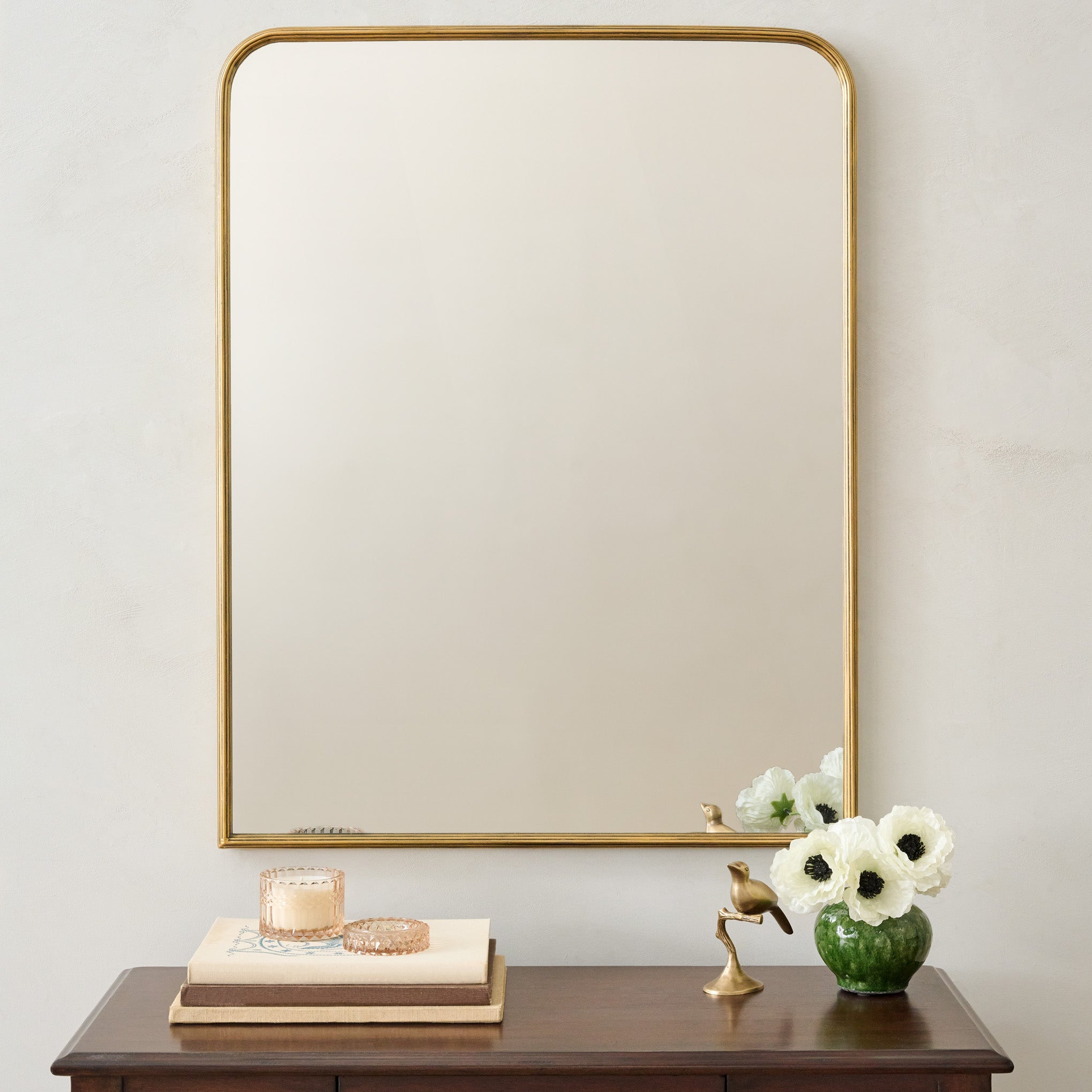Collin Ribbed Brass Vanity Mirror shown above vanity