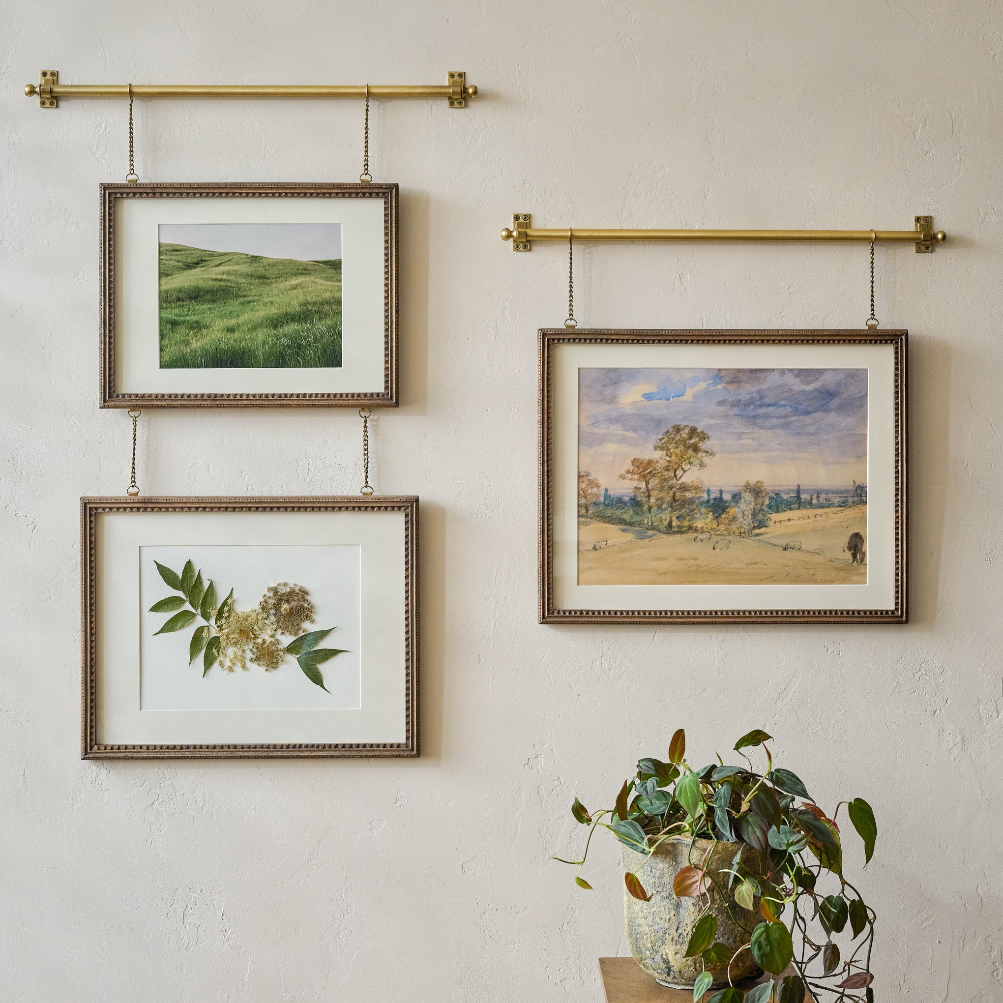 Colleen Wood and Brass Rail Double Picture Frame shown styled on wall