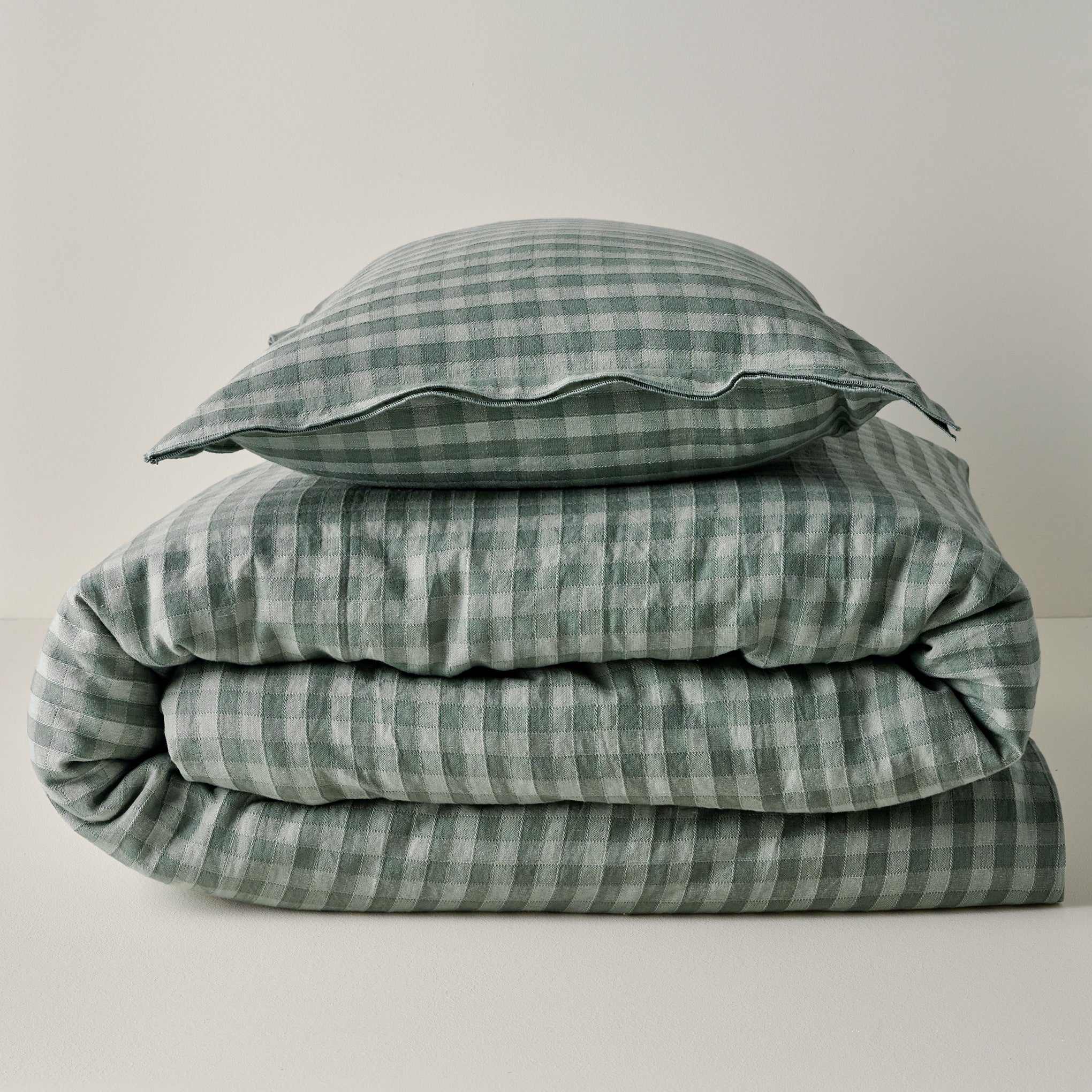 Maxine Gingham Duvet Cover in dusty green shown with coordinating sham