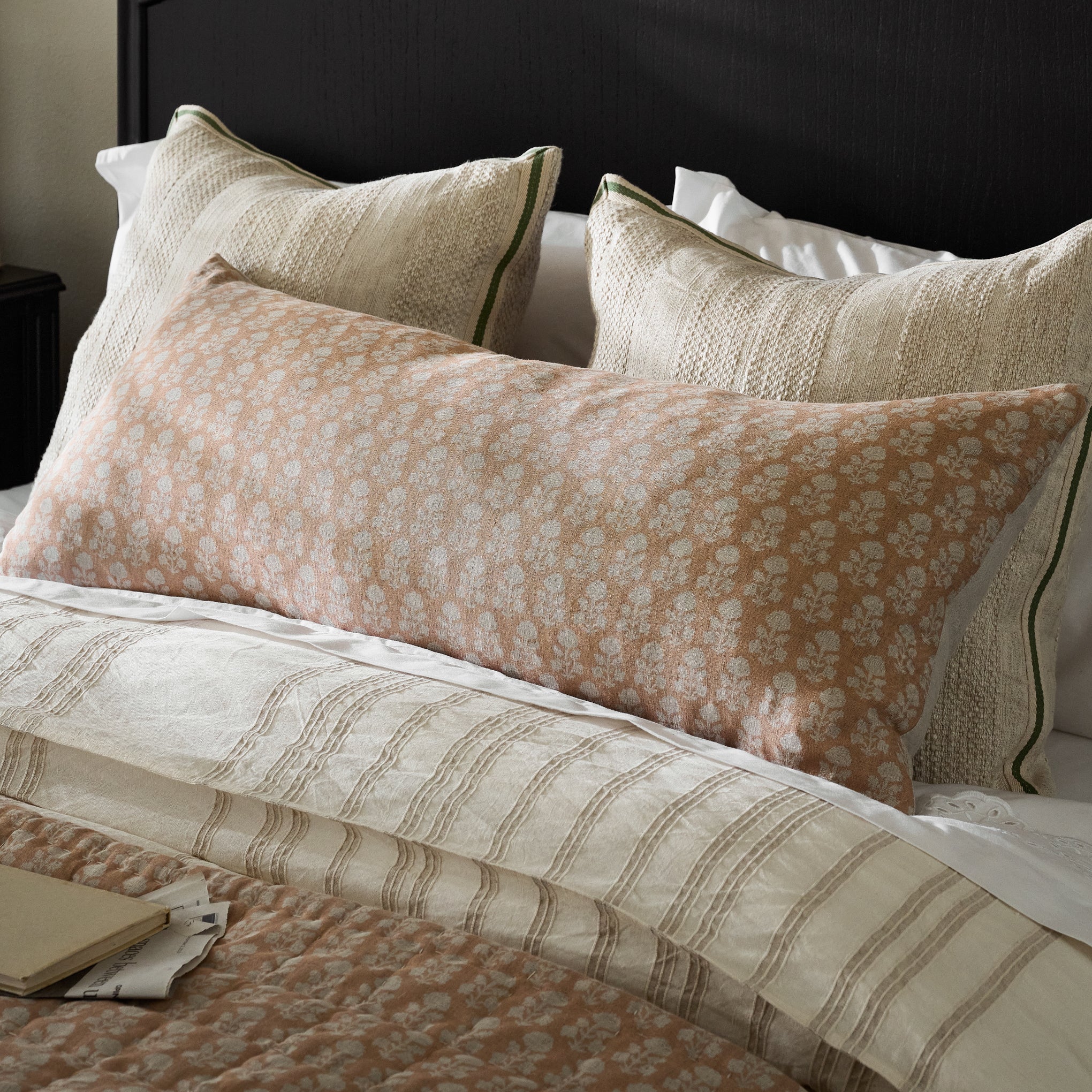 Ellie Block Printed Lumbar Pillow shown on bed